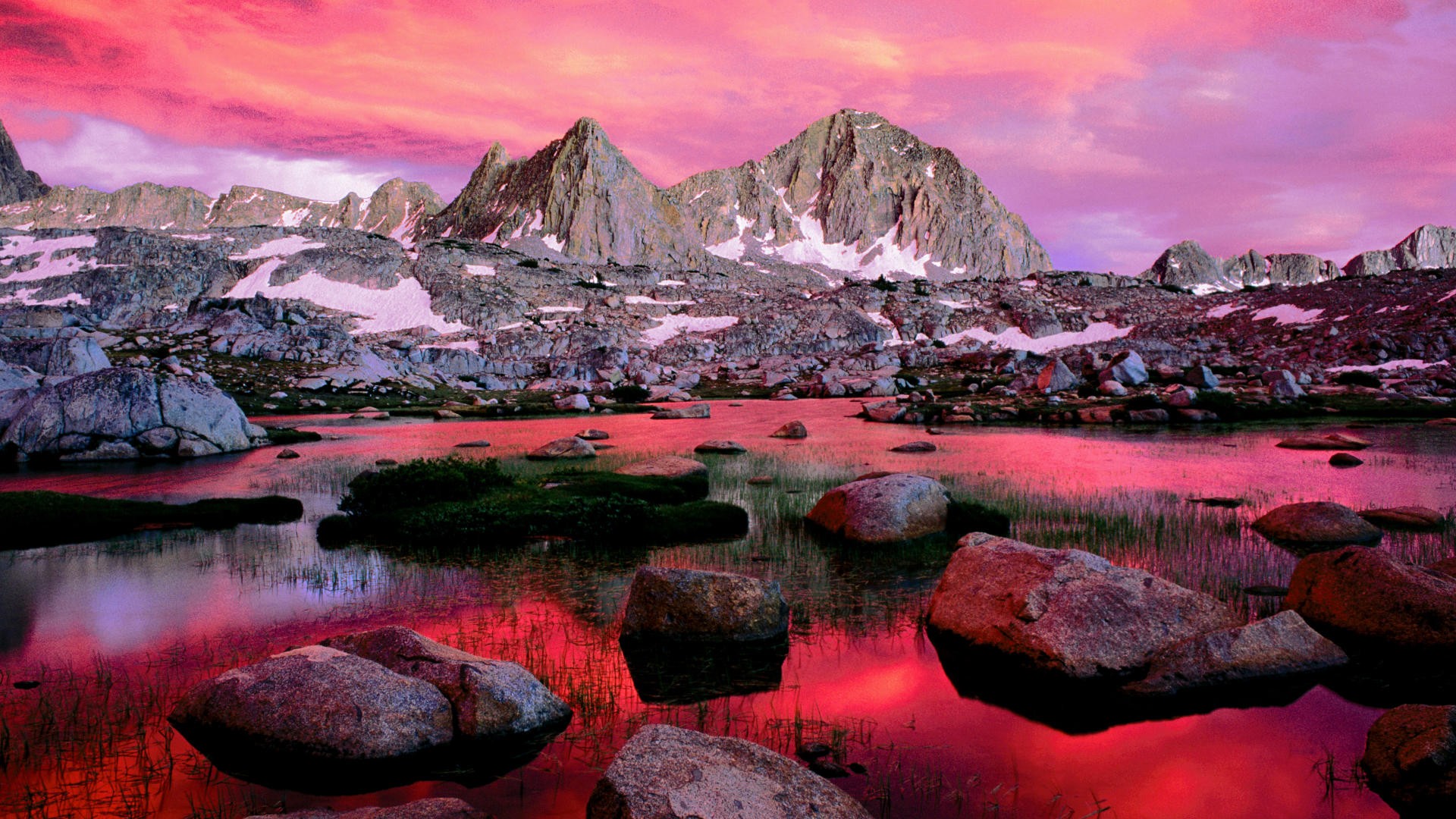 Mountain lake reflecting pink sky HD Wallpaper