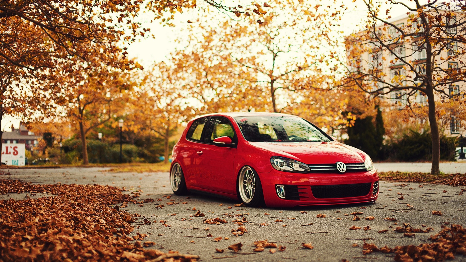 Red Volkswagen Golf parked in autumn HD Wallpaper