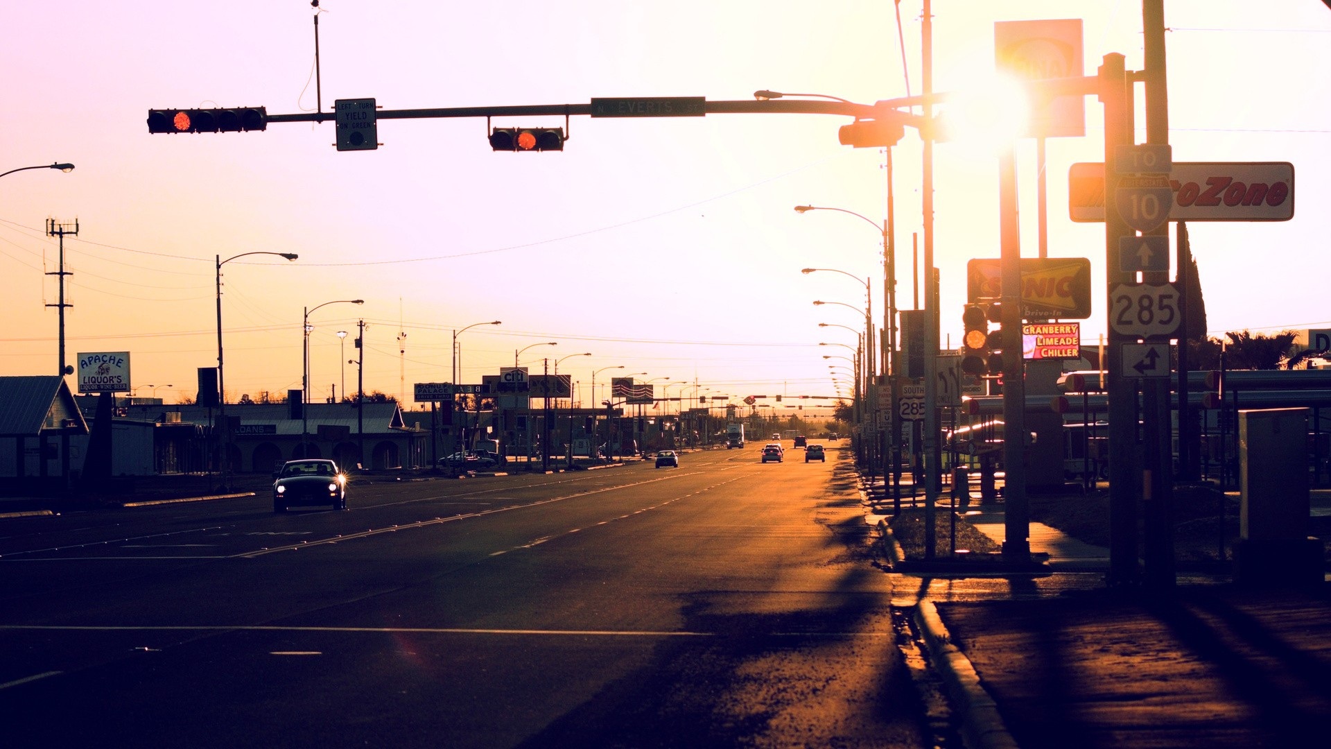 Street view with traffic lights and cars at sunset HD Wallpaper