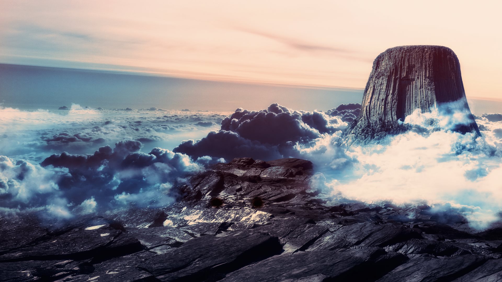 Mountain peak above clouds at sunset HD Wallpaper