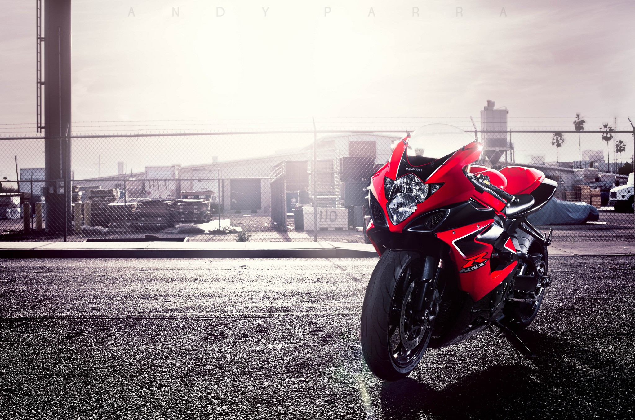 Red Suzuki motorcycle parked on asphalt HD Wallpaper