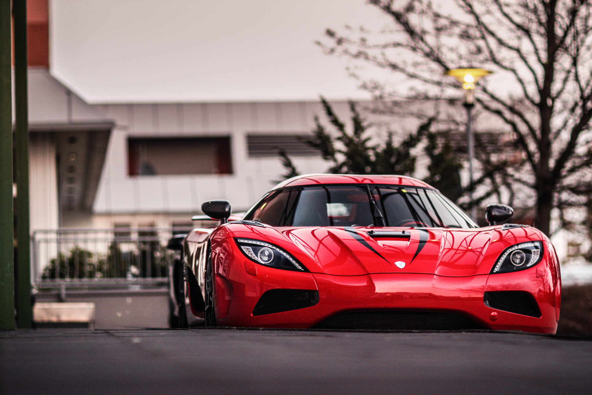 Red Koenigsegg Agera RS parked outside building HD Wallpaper