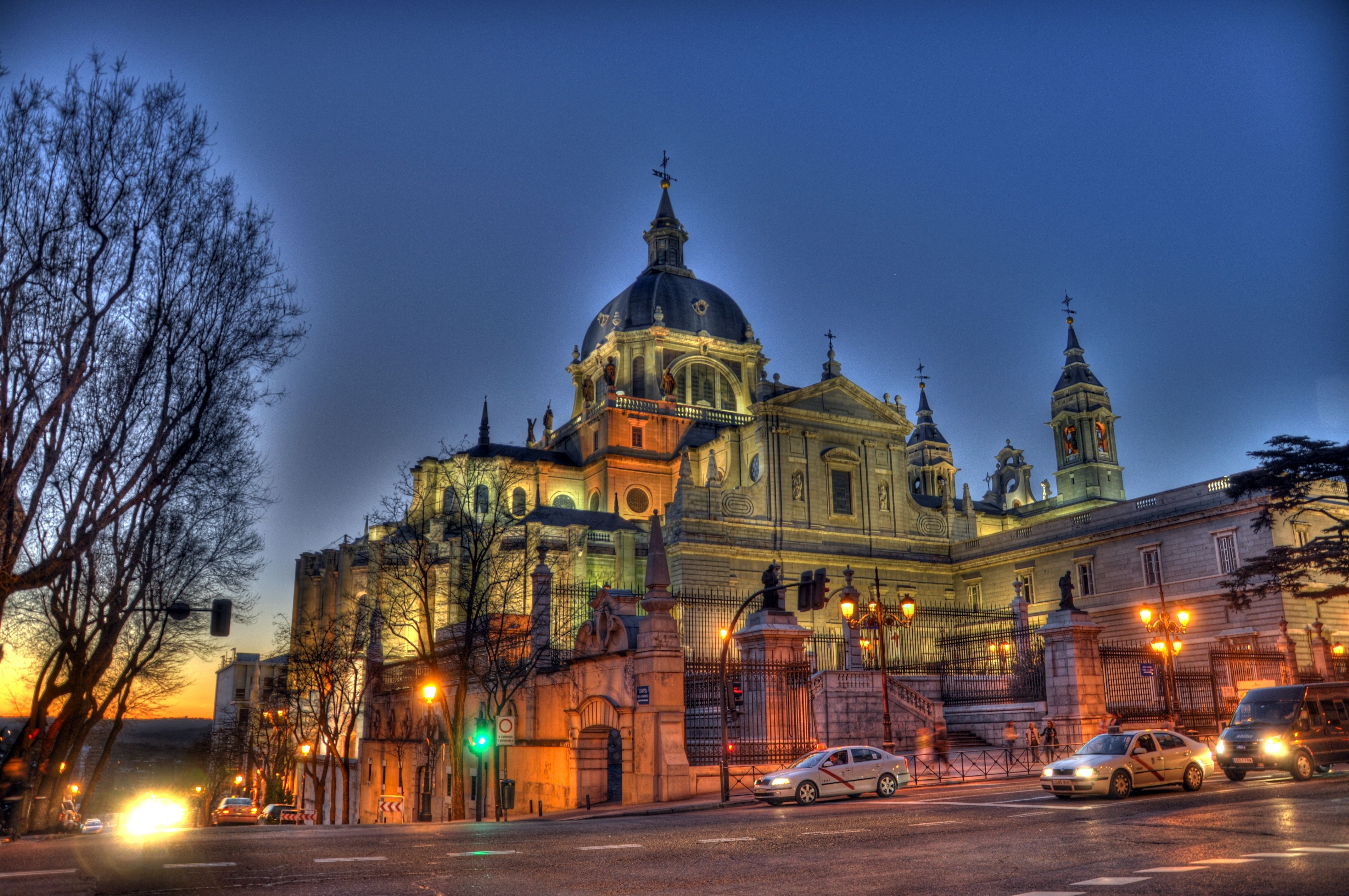 Almudena Cathedral at dusk with cars HD Wallpaper