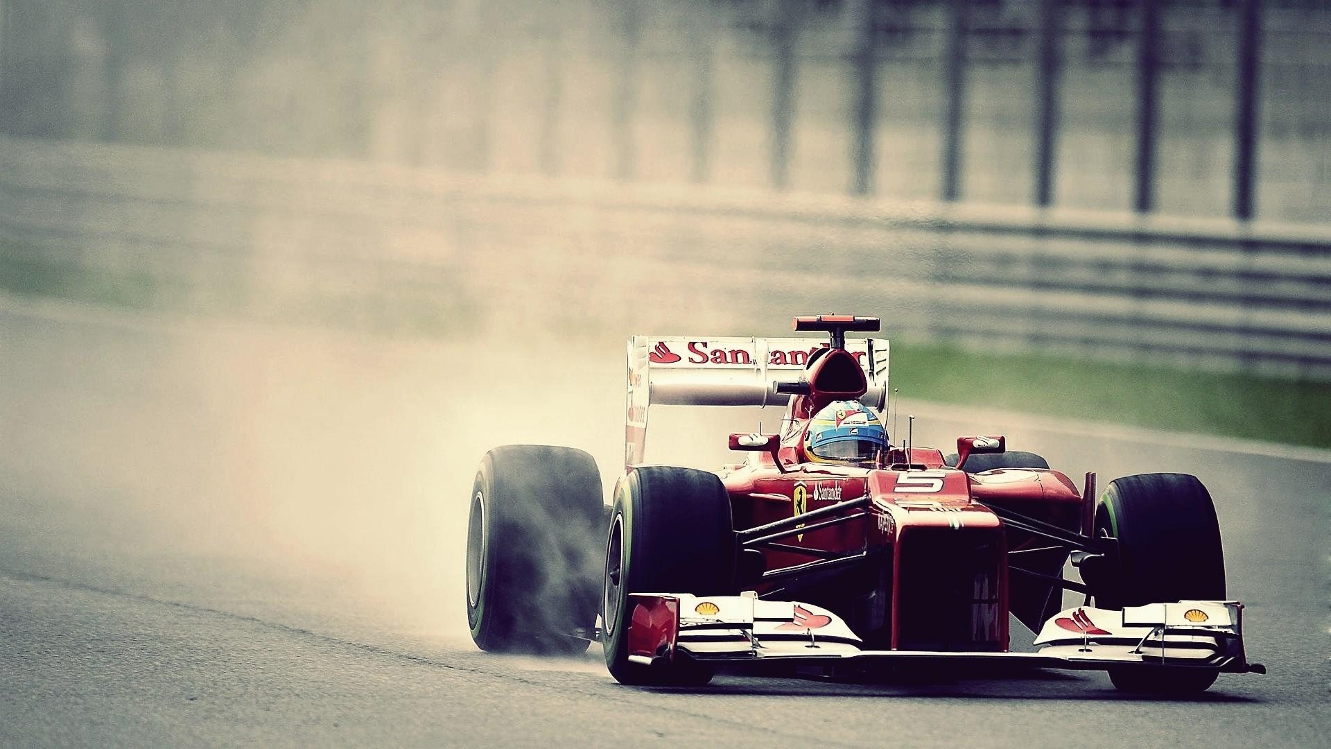 Ferrari Formula 1 car on a wet track HD Wallpaper