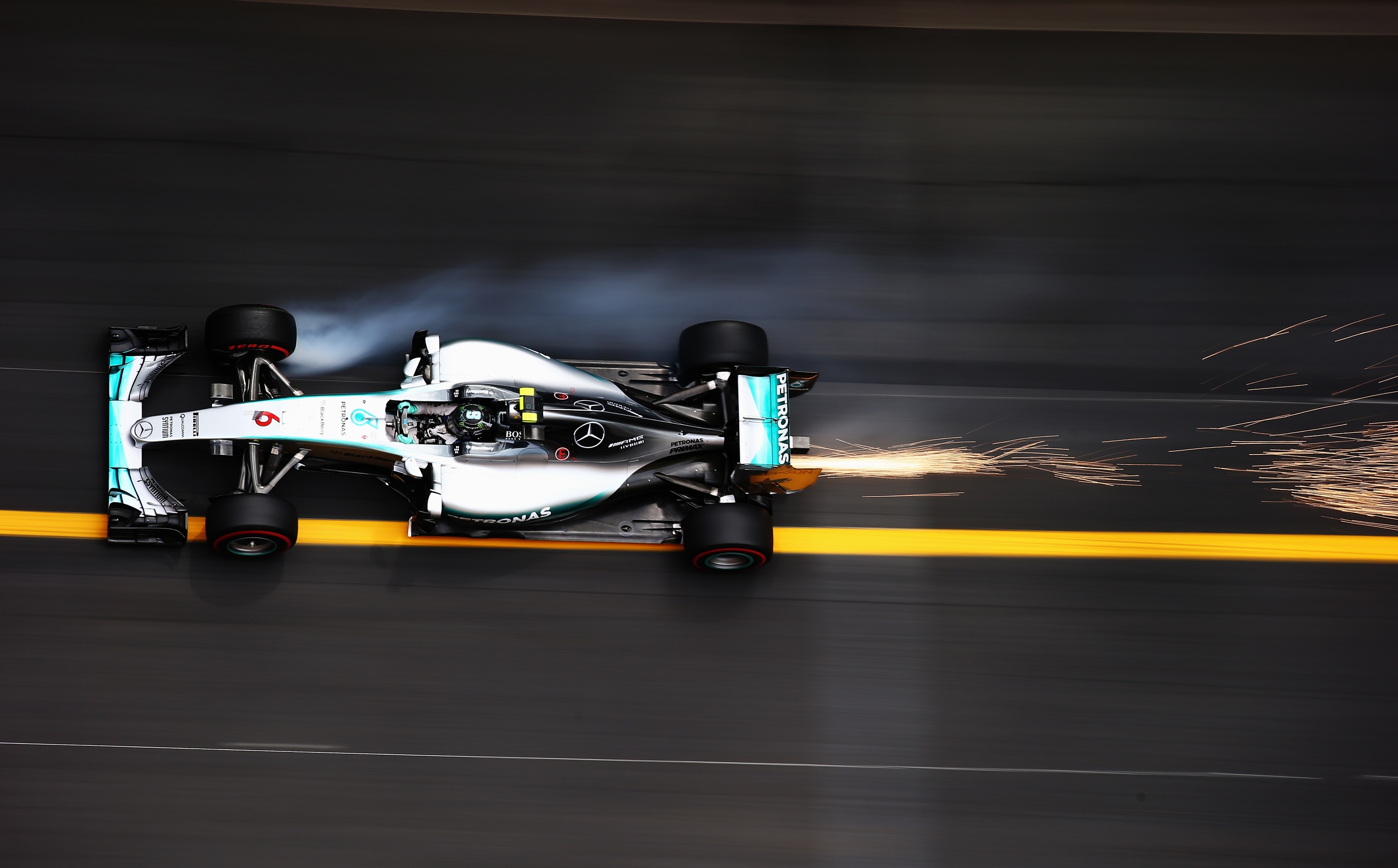 Formula 1 car racing with sparks HD Wallpaper