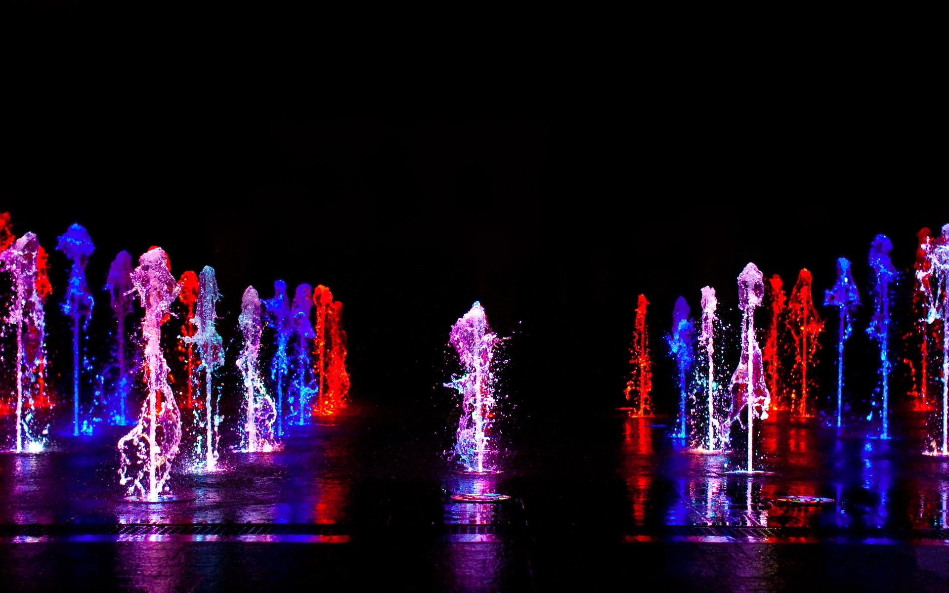 Colorful water fountains at night HD Wallpaper