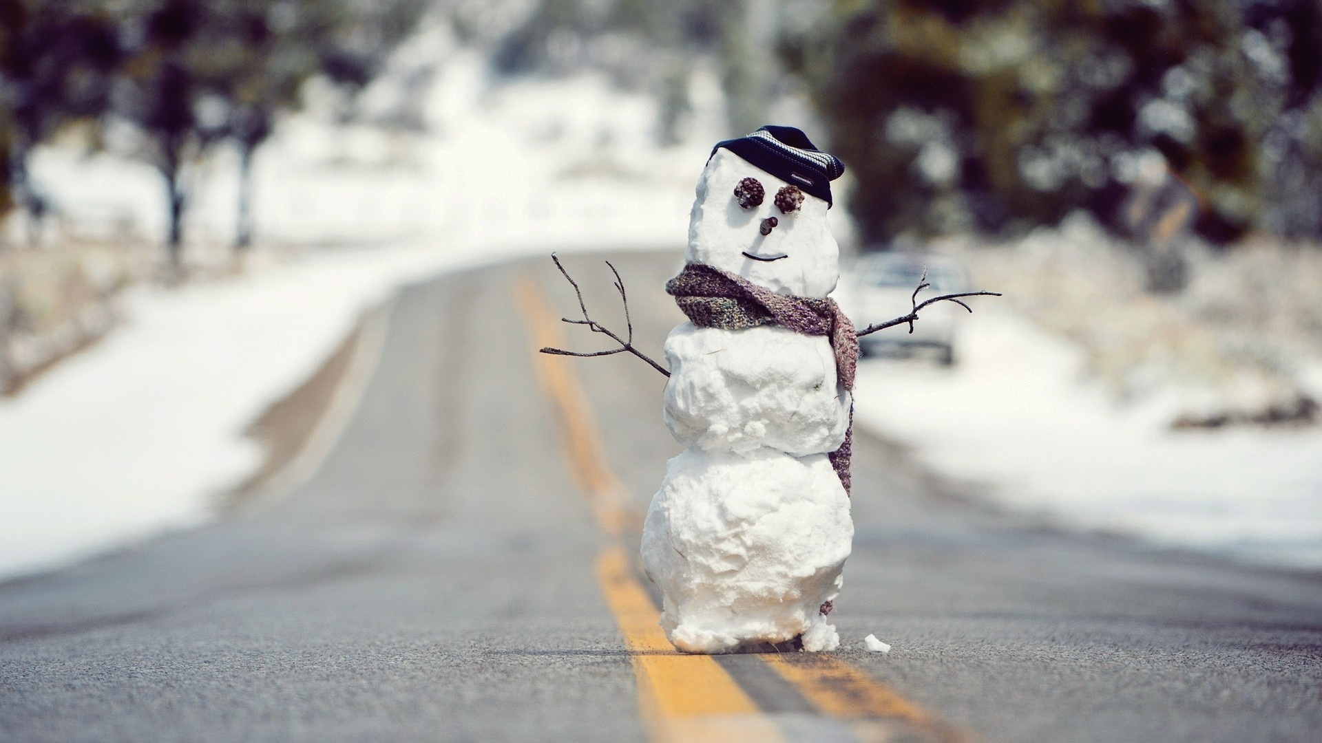 Snowman on a winter road HD Wallpaper