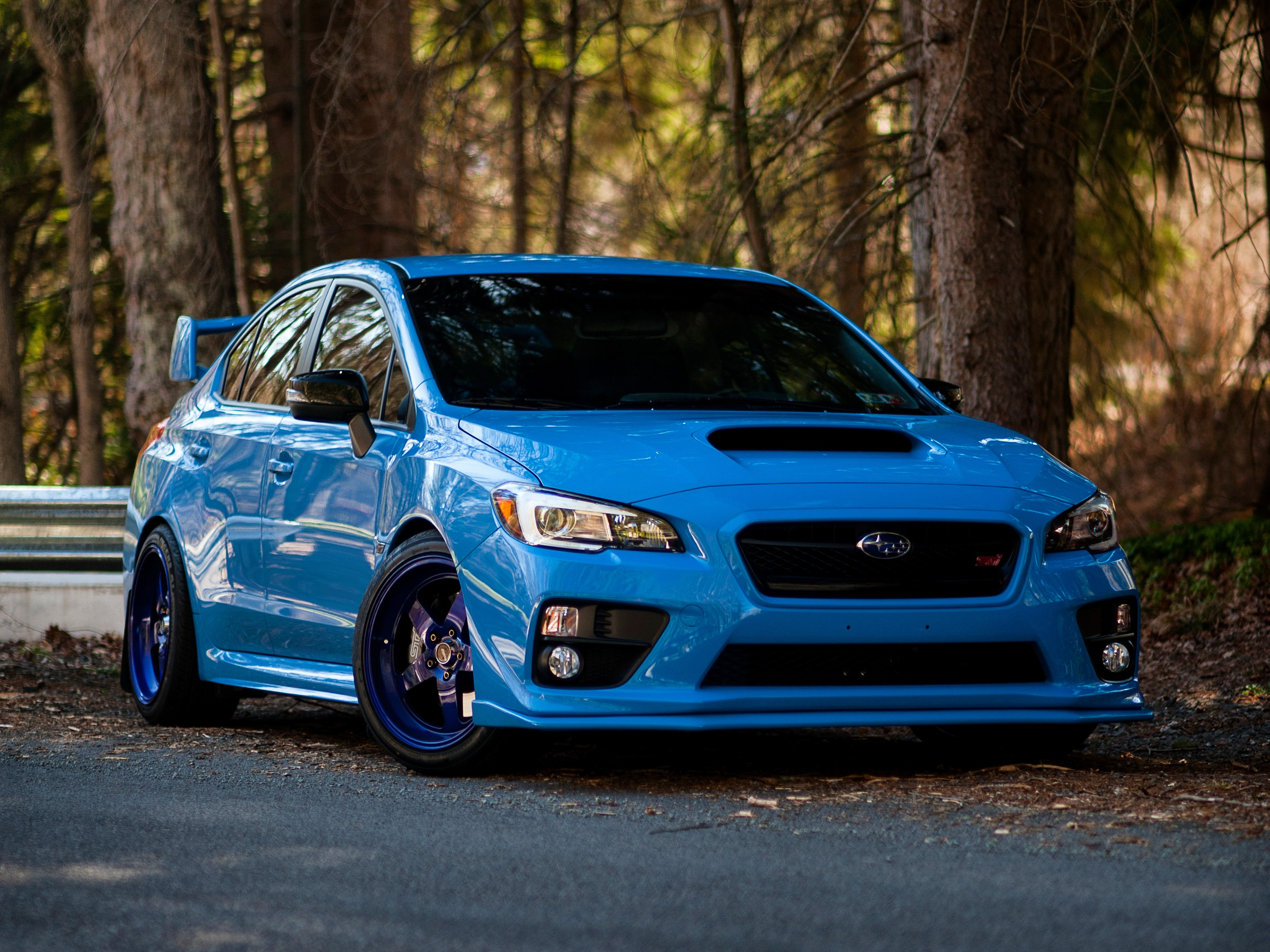 Blue Subaru WRX STI parked on a road HD Wallpaper