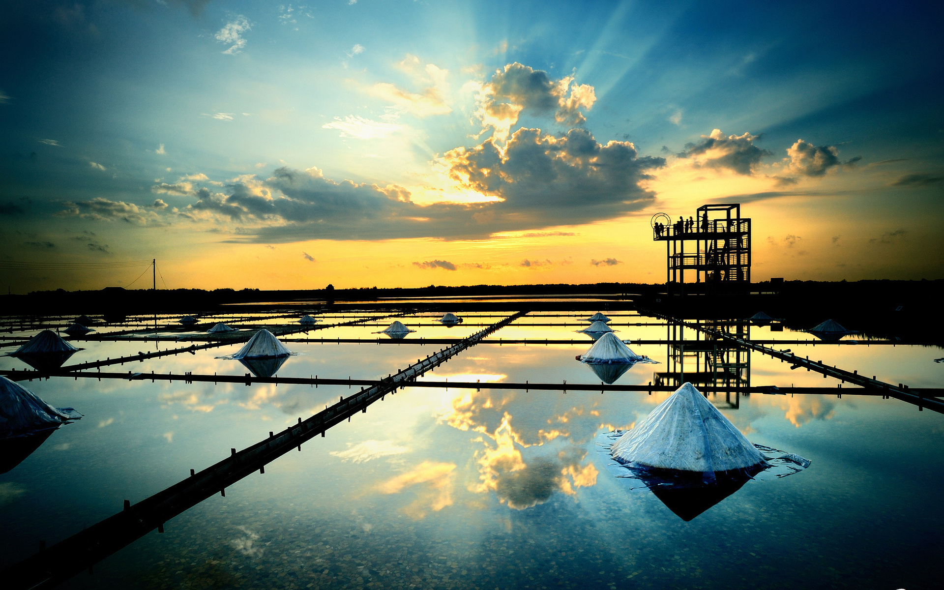 Salt fields at sunset with reflection HD Wallpaper