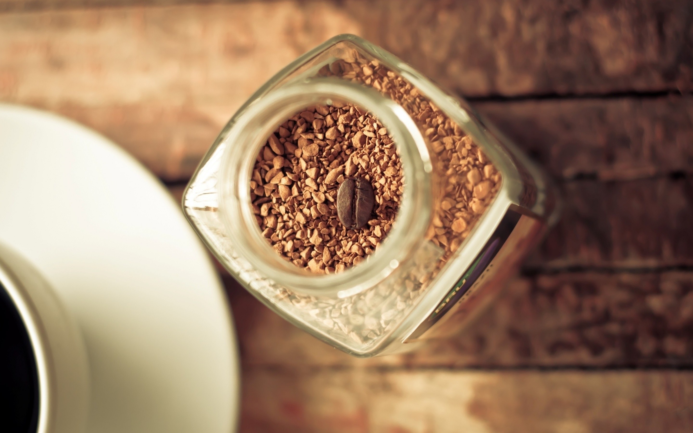 Instant coffee in a jar with a coffee bean HD Wallpaper