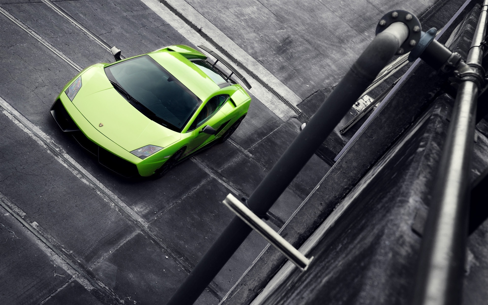 Green Lamborghini on a concrete surface HD Wallpaper