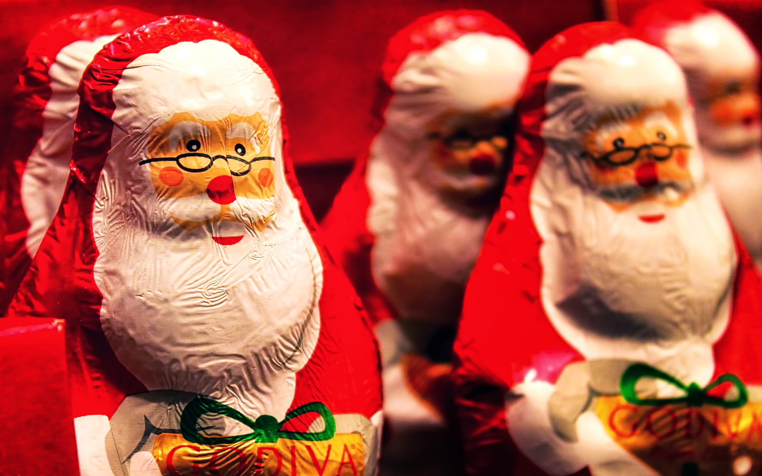Chocolate Santas in Red Wrapping HD Wallpaper