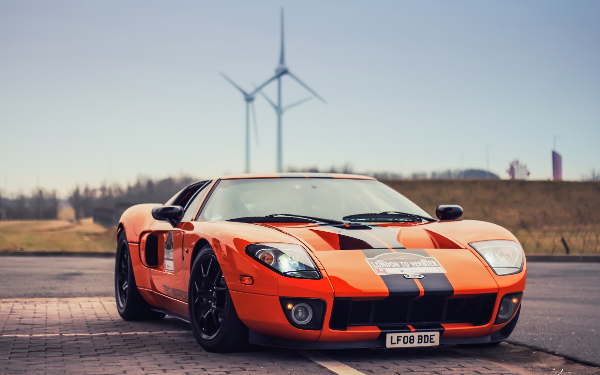 Orange Ford GT with racing stripes HD Wallpaper