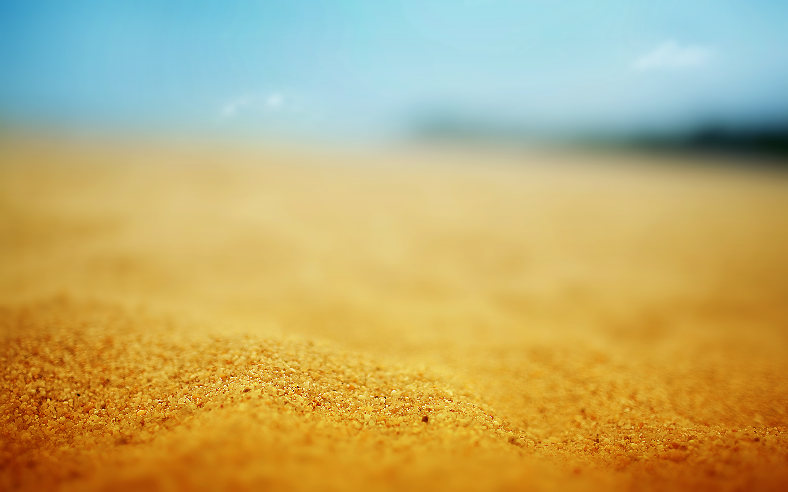 Close up of sand with blue sky HD Wallpaper
