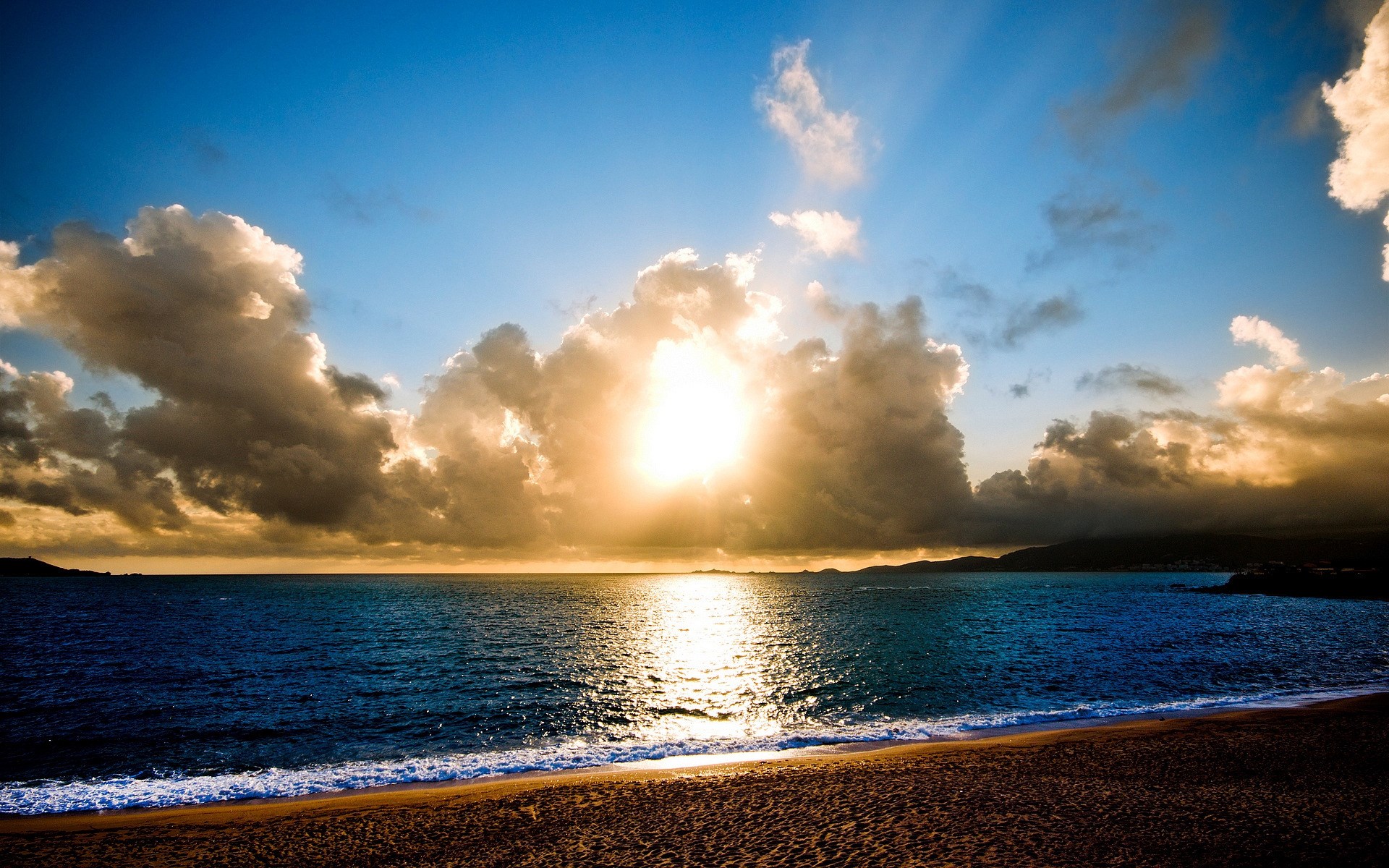Sunset over the ocean with clouds and beach HD Wallpaper