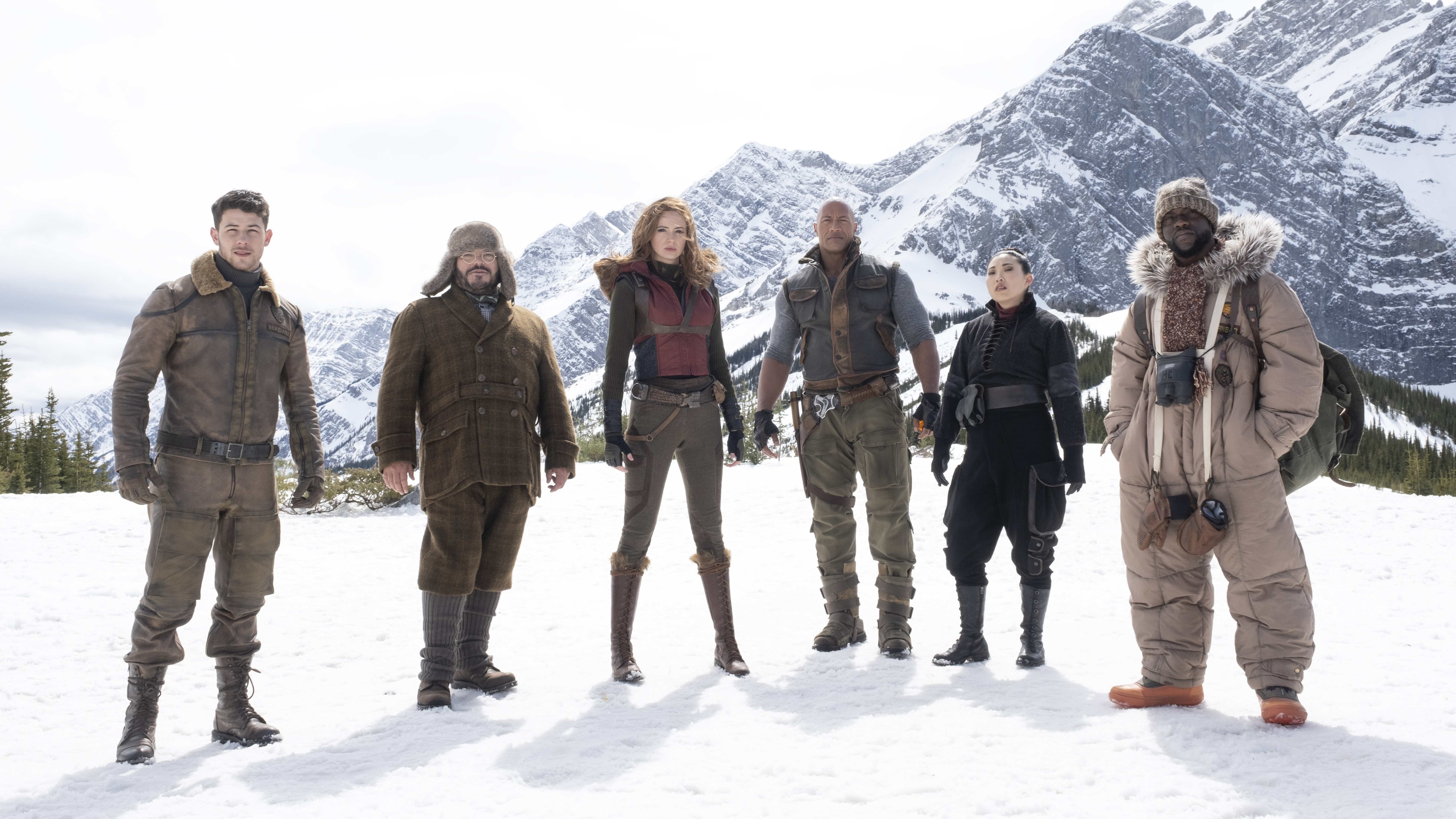 Jumanji: The Next Level Cast in Snowy Mountains HD Wallpaper