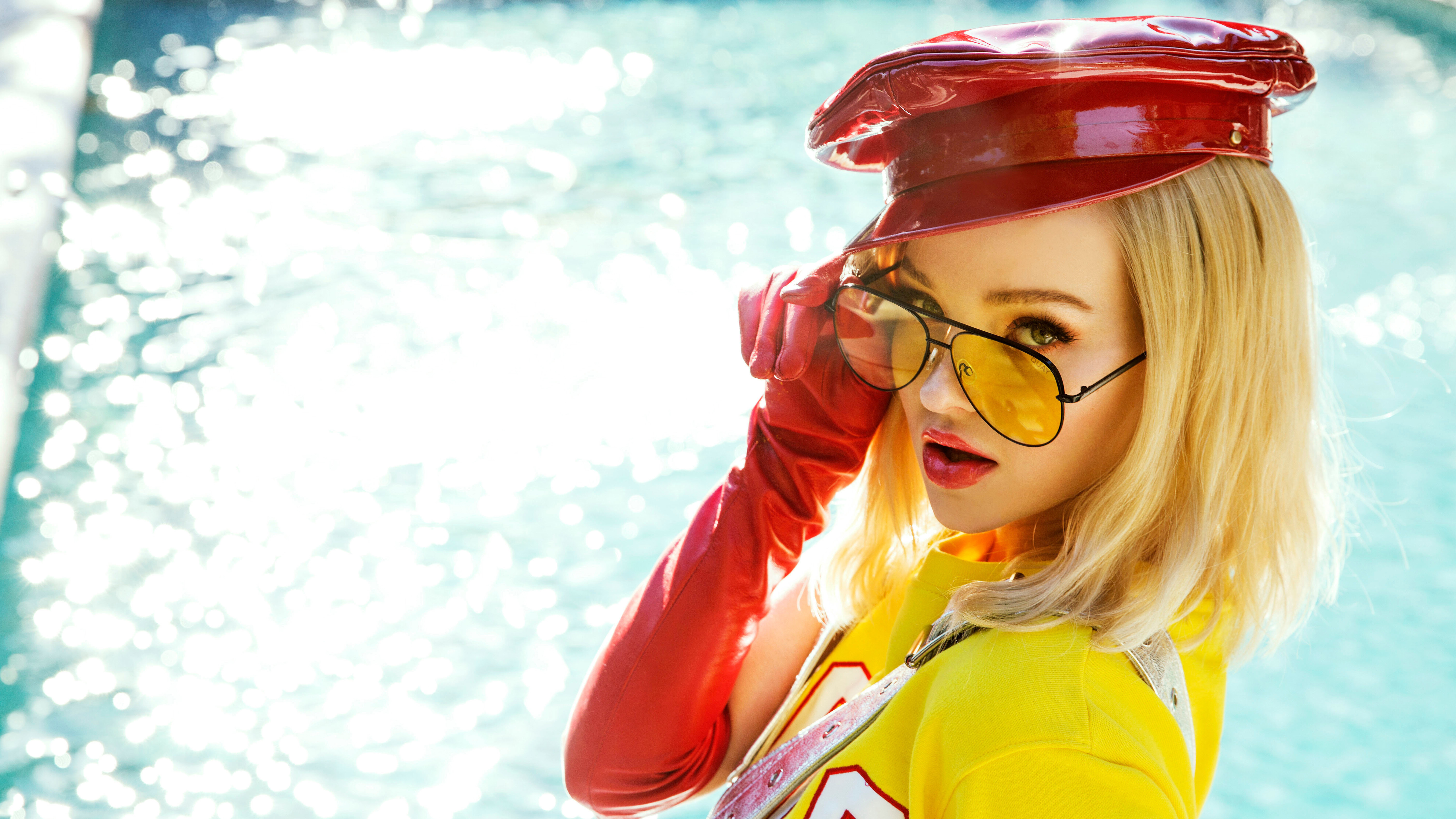 Dove Cameron in red hat and yellow shirt HD Wallpaper