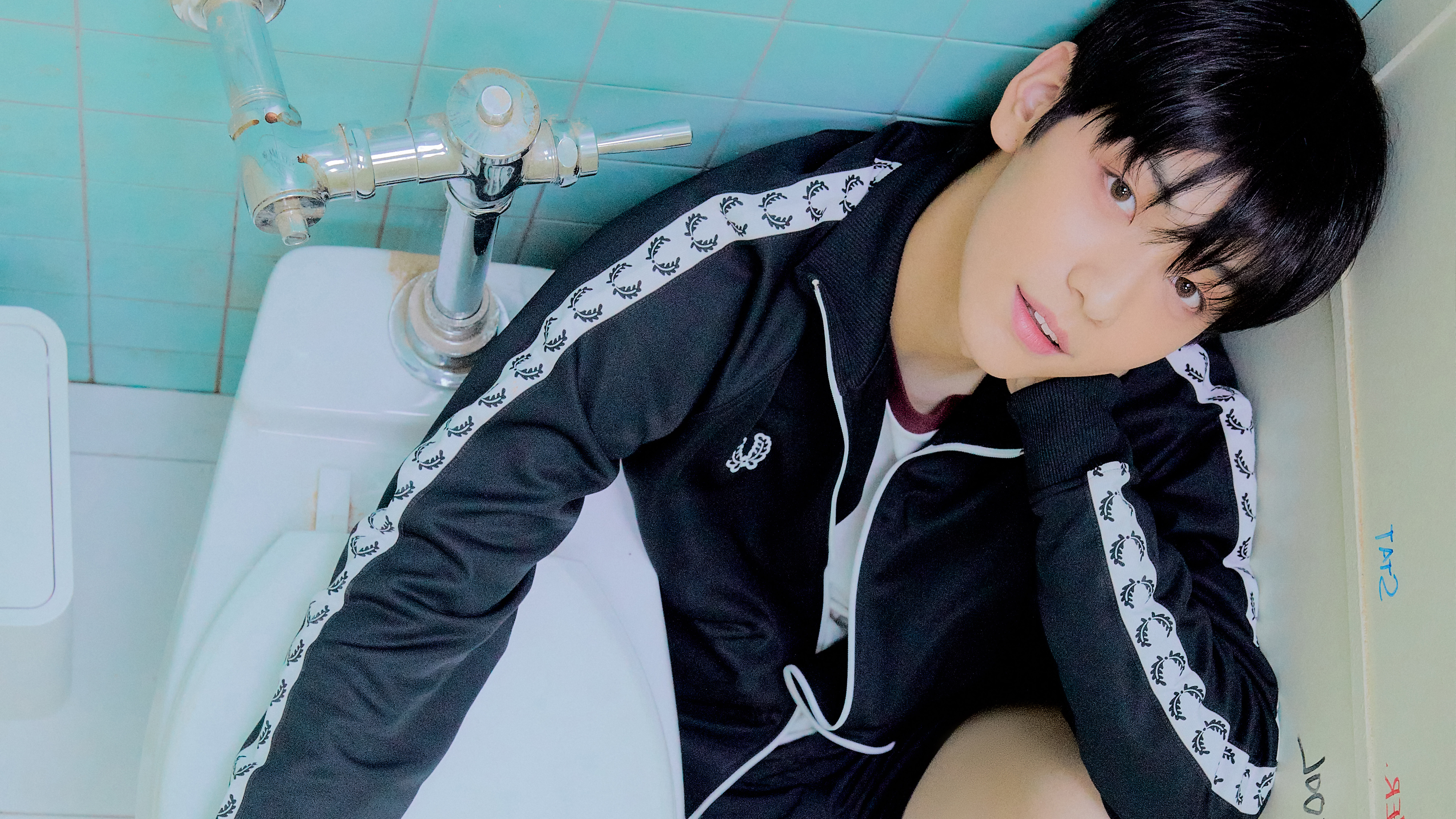 Man in tracksuit sitting by toilet HD Wallpaper