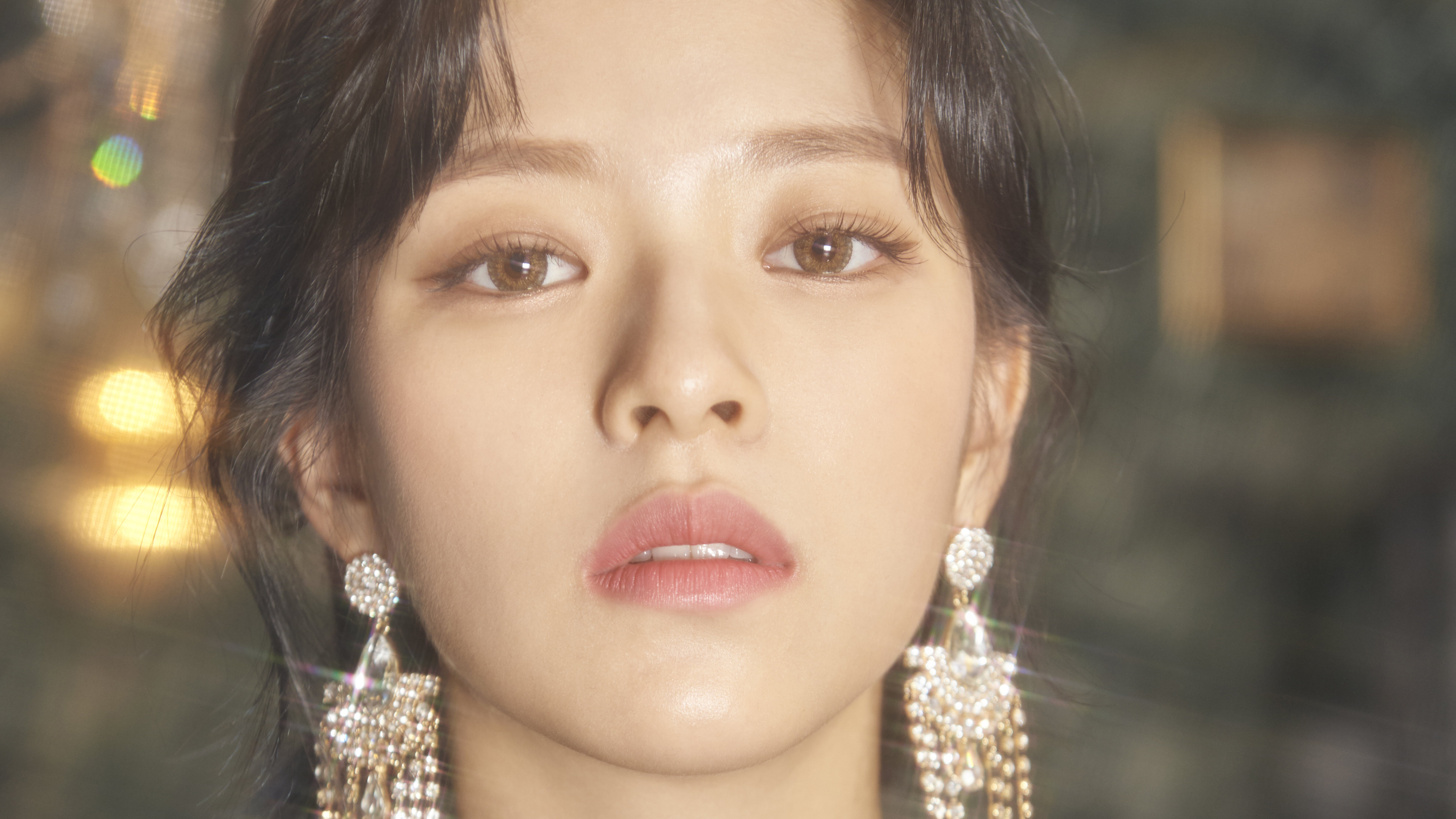 Close-up of a woman with large earrings HD Wallpaper