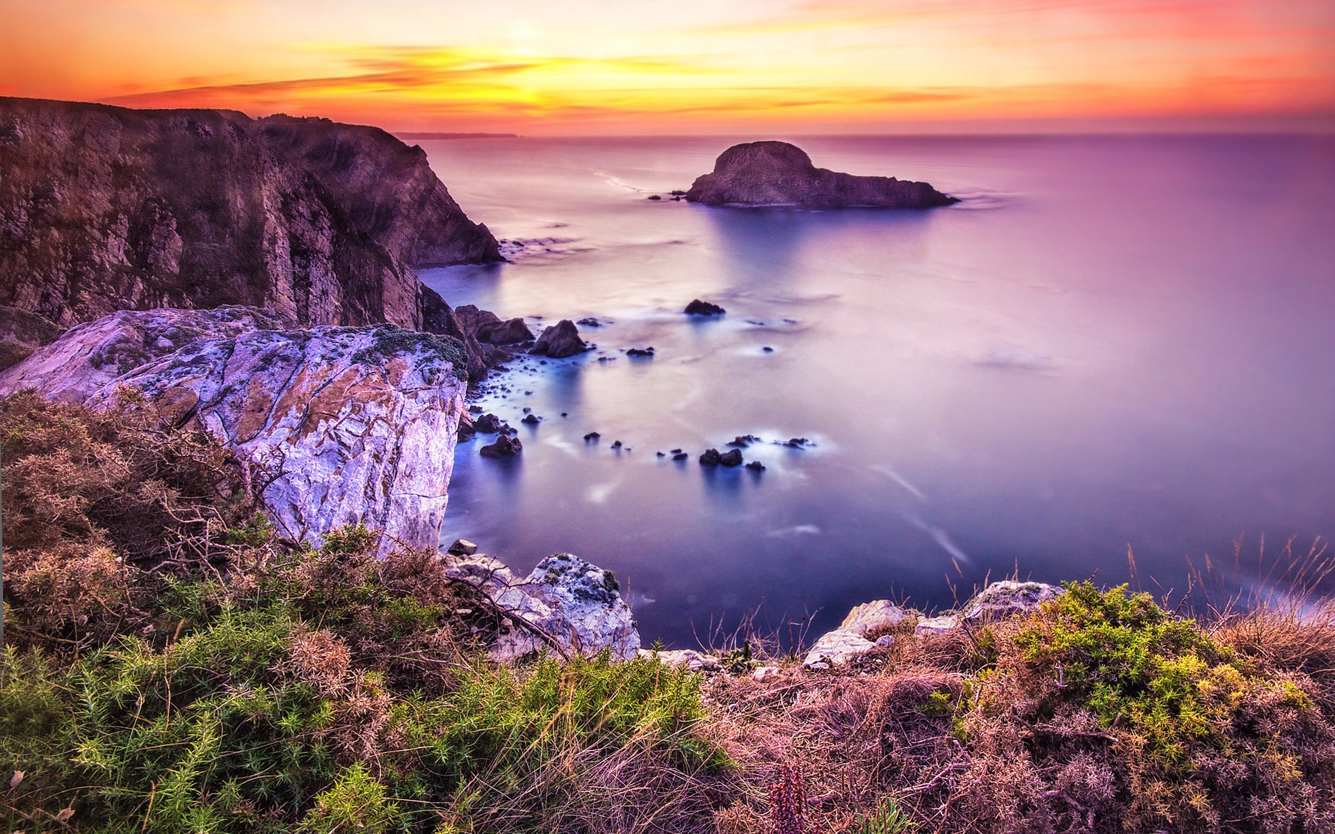 Sunset over rocky coastline and ocean HD Wallpaper
