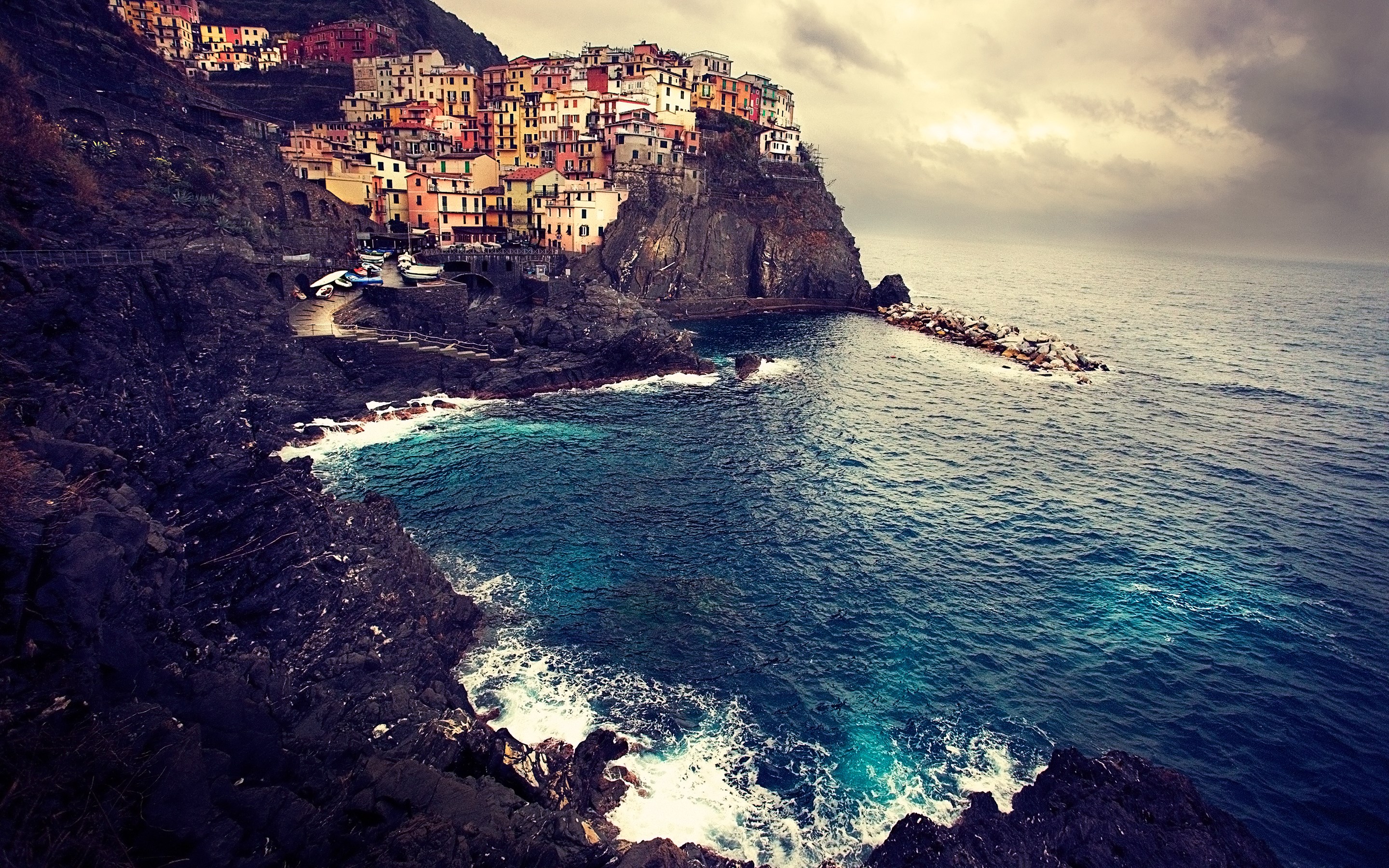 Colorful village on a cliff overlooking the sea HD Wallpaper