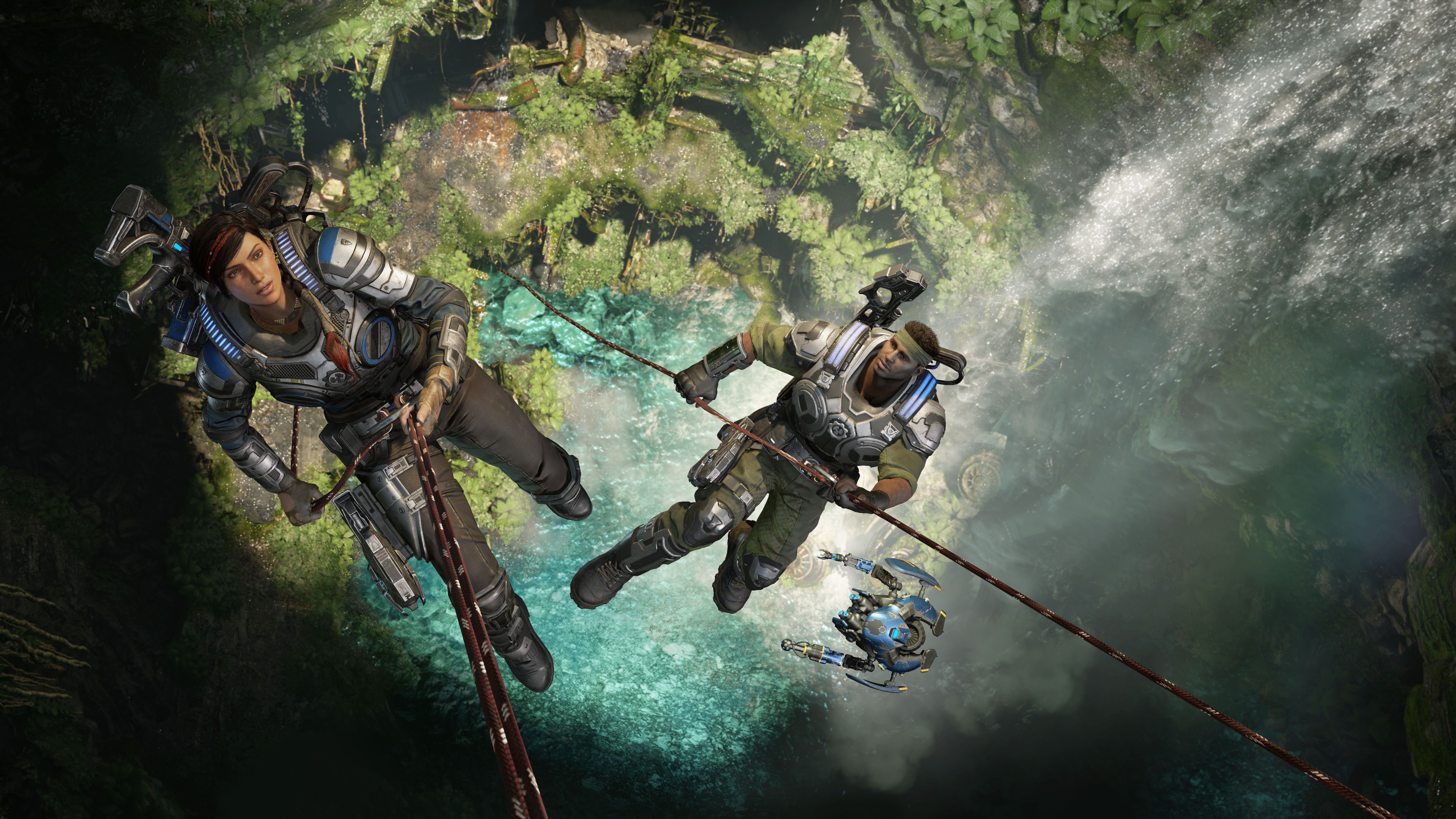 Kait Diaz and JD Fenix rappelling in a jungle chasm HD Wallpaper