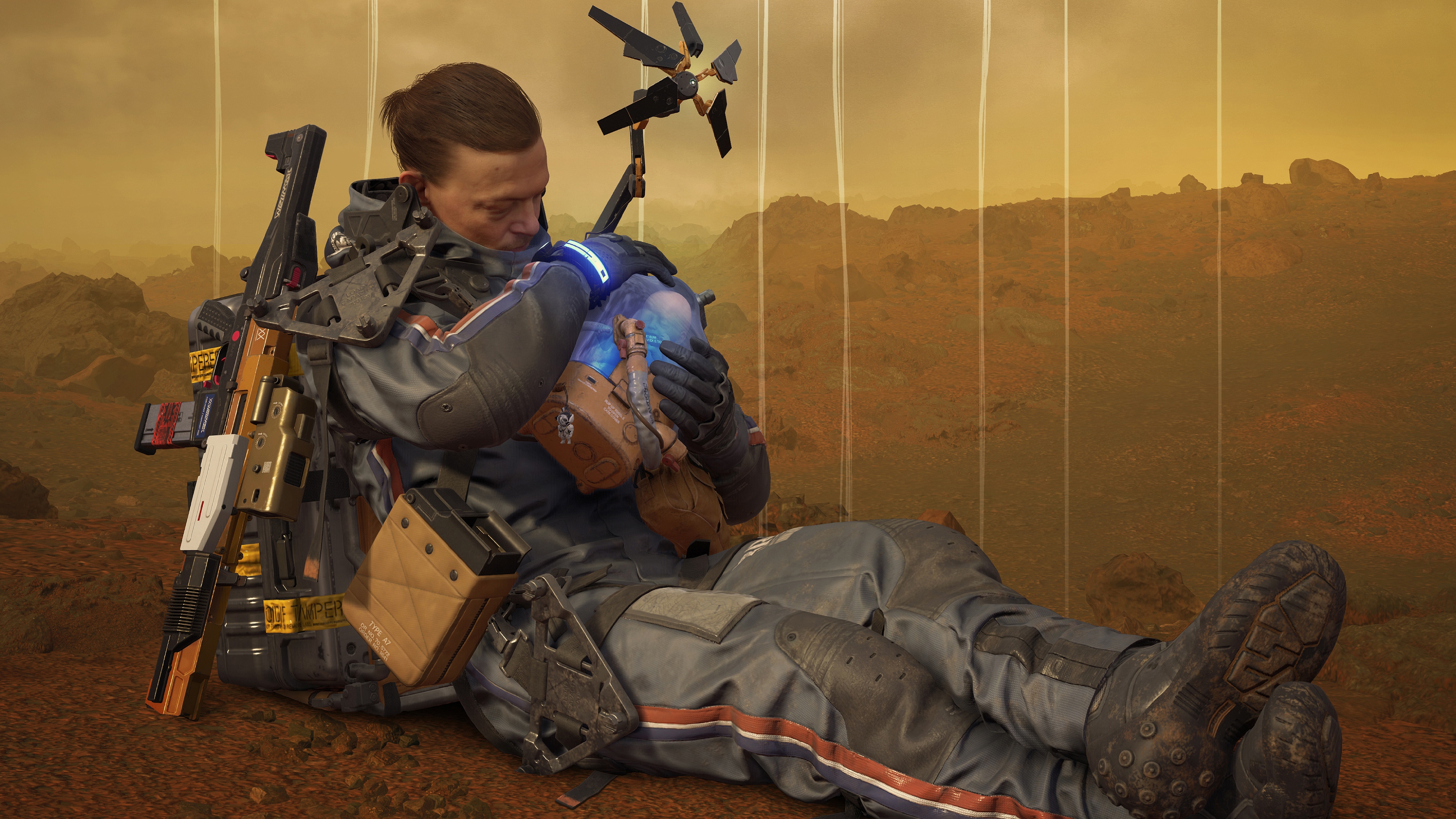 Sam from Death Stranding holding a BB pod HD Wallpaper