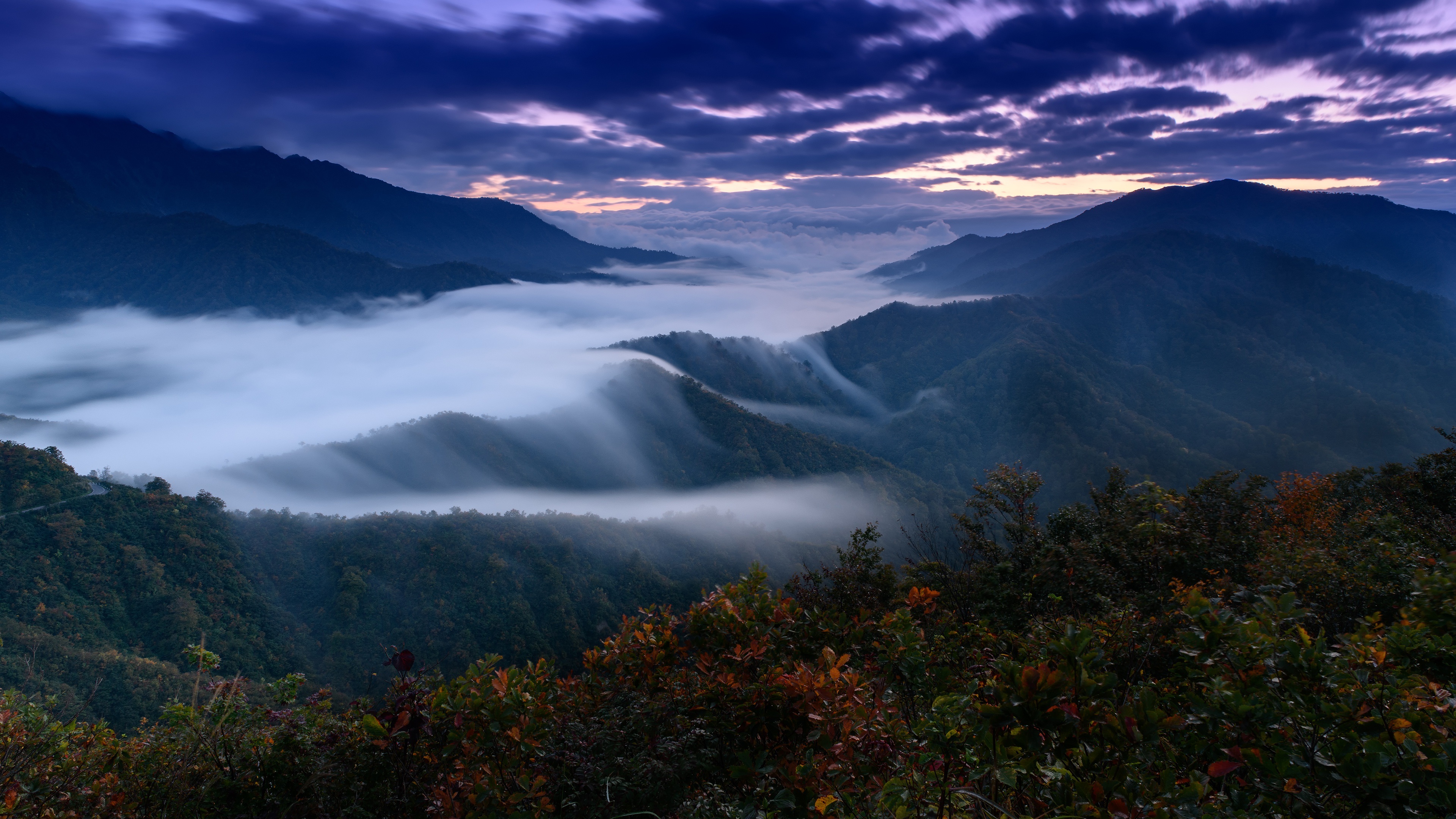 Mountain landscape with fog and clouds at sunrise 4K HD Wallpaper