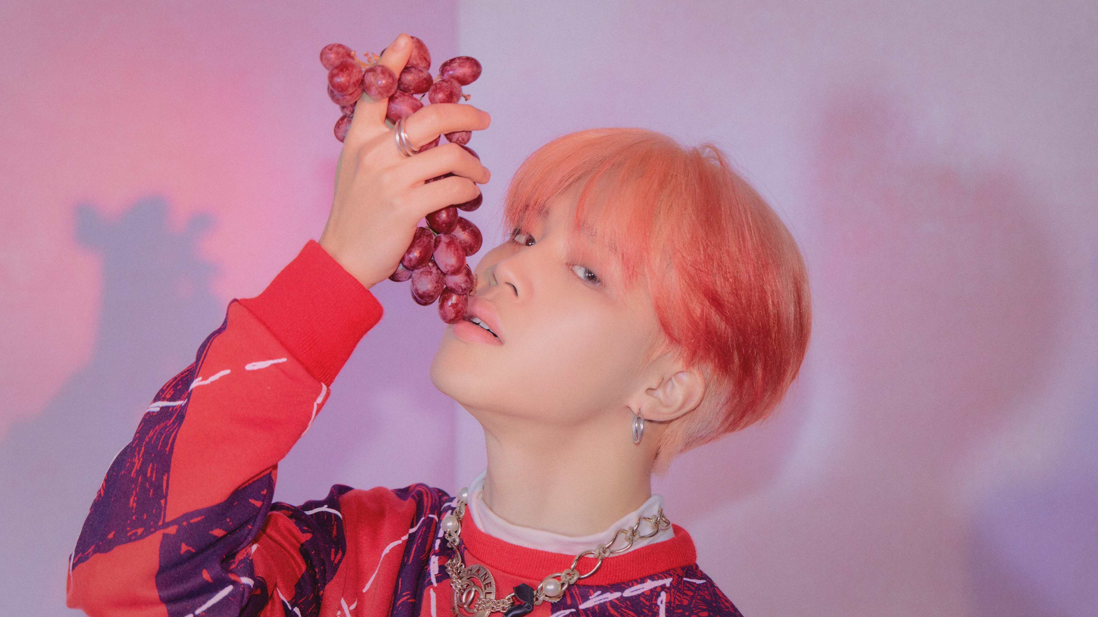 Jimin from BTS holding grapes HD Wallpaper