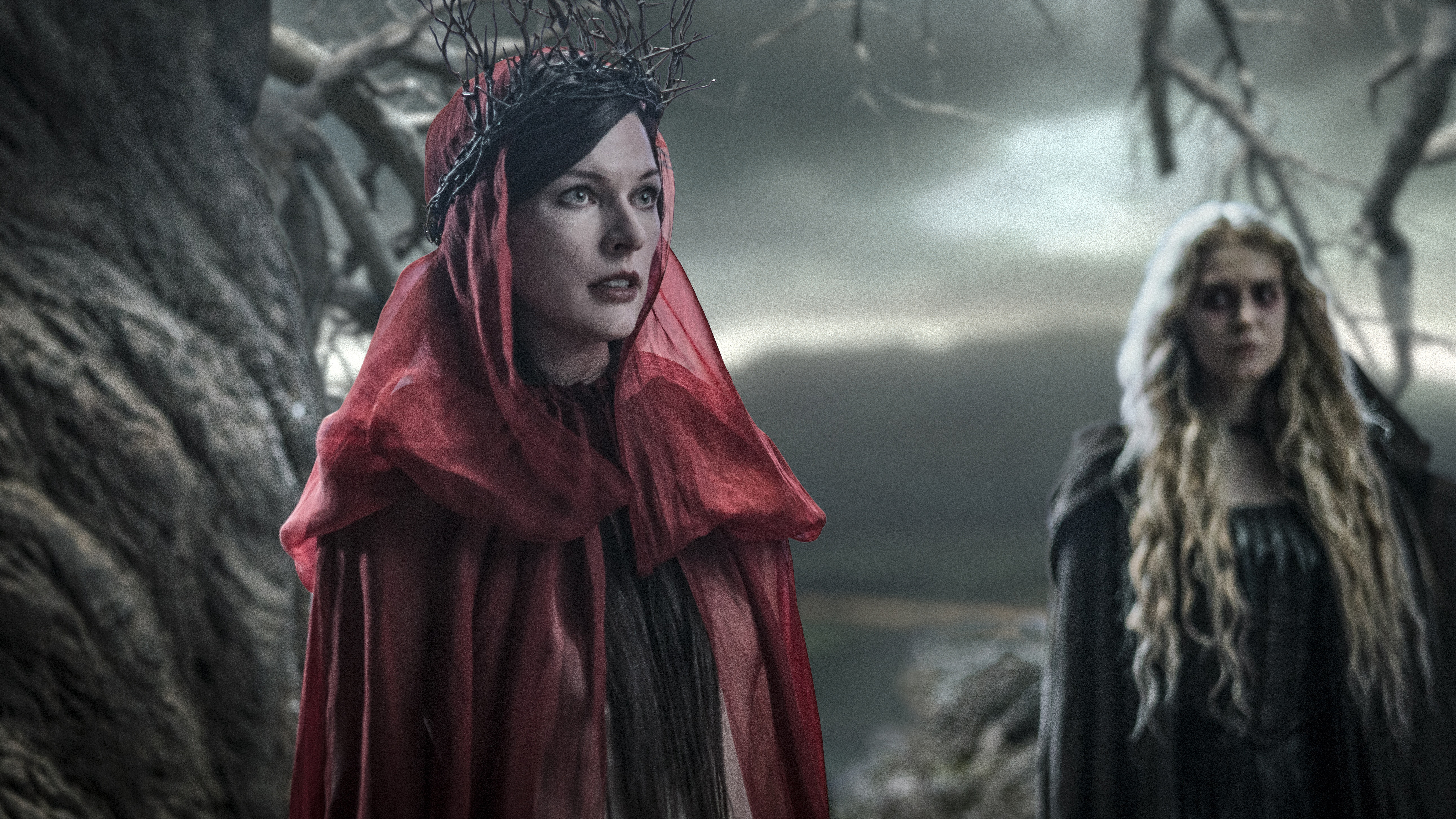 Woman in red with thorny crown and woman with blonde hair HD Wallpaper