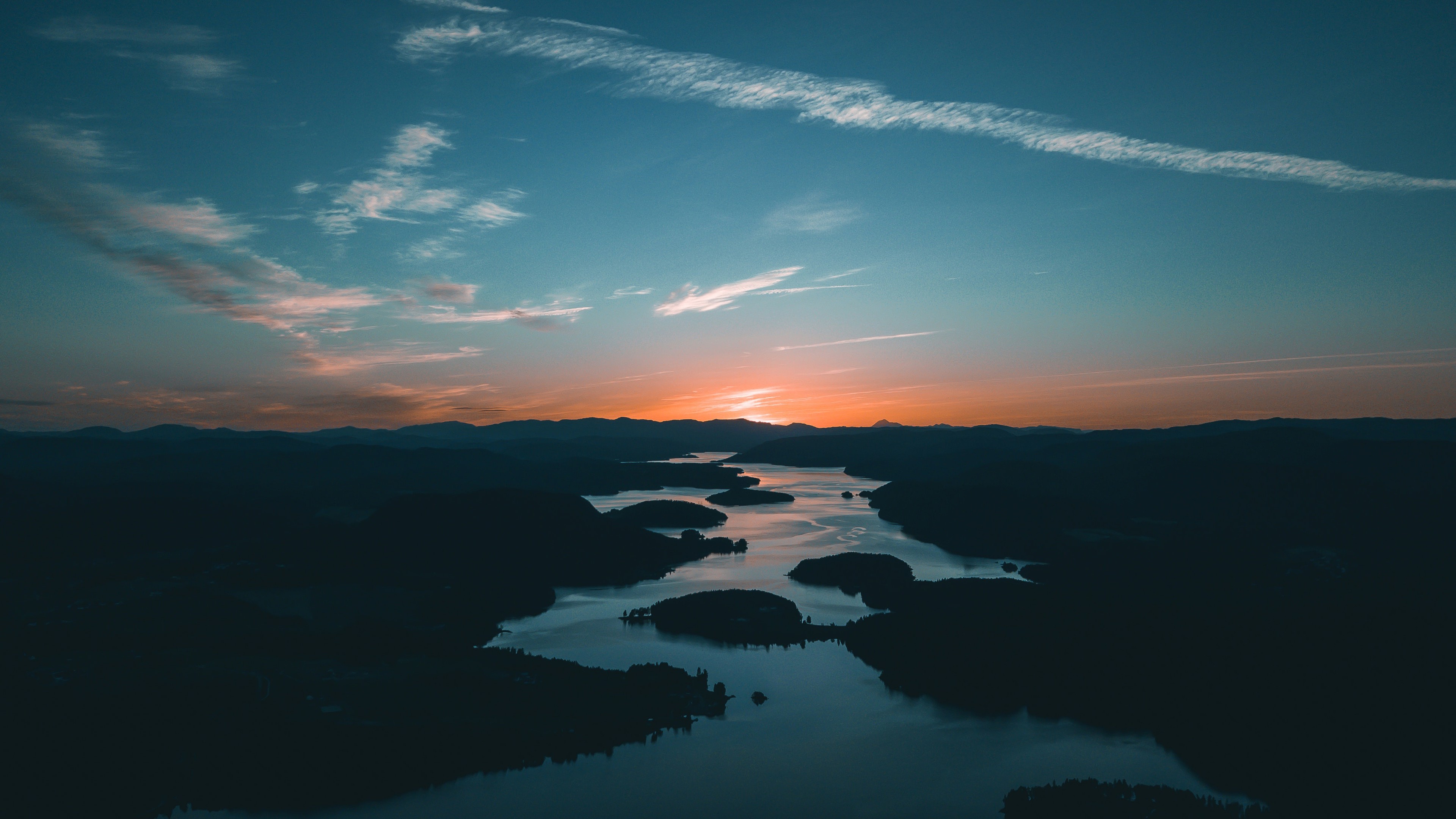 Sunrise over a winding river and mountains HD Wallpaper