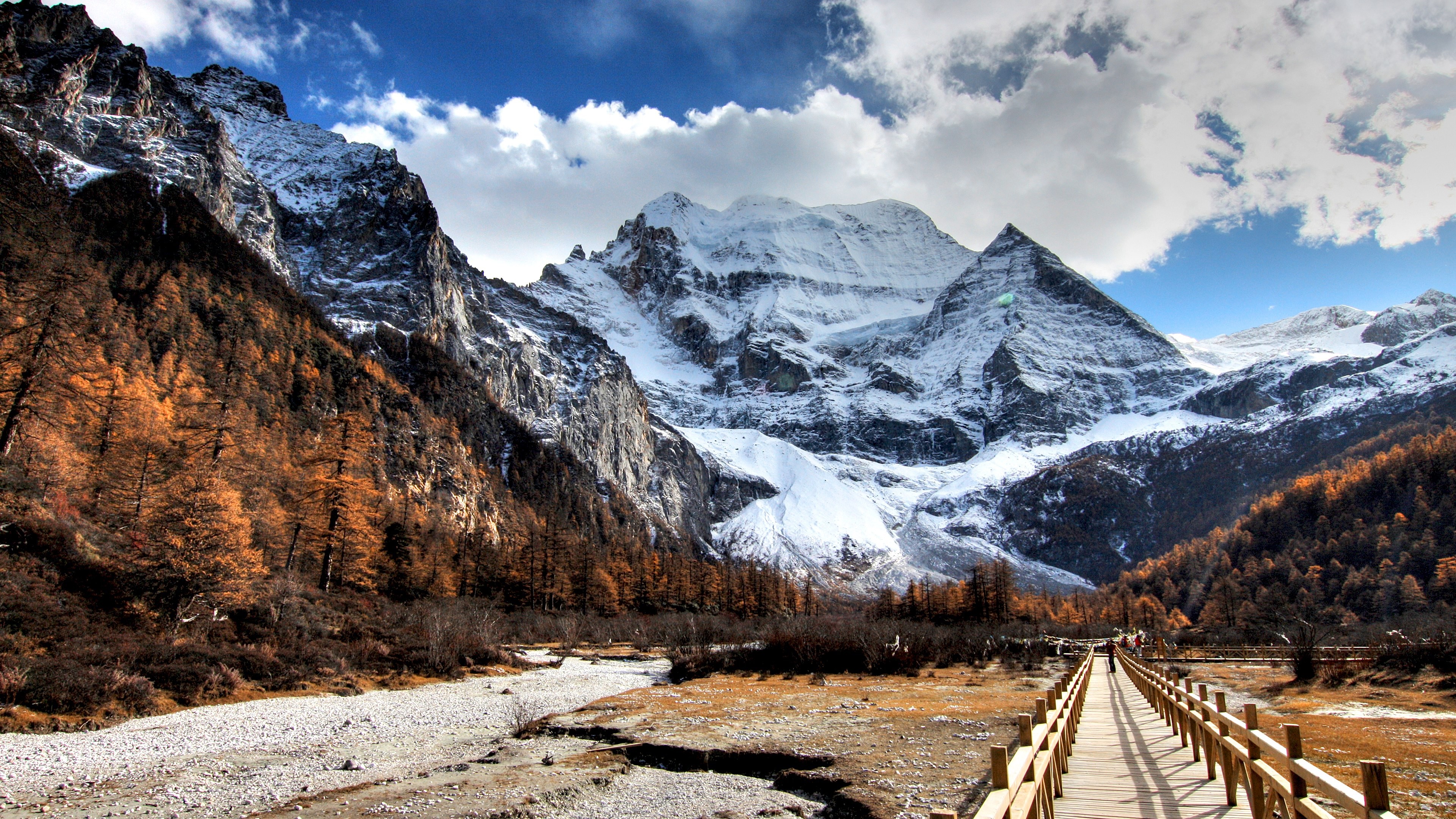 Snowy Mountains and Autumn Forest with Wooden Bridge HD Wallpaper