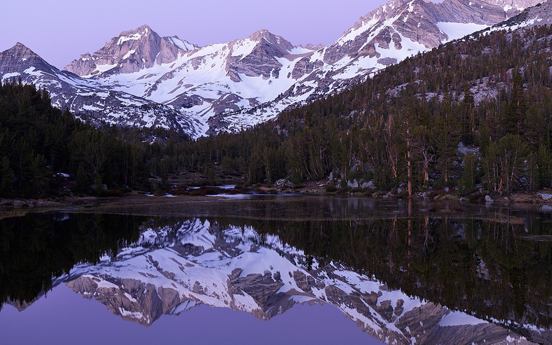 Snow-capped mountains reflected in a lake at dawn HD Wallpaper