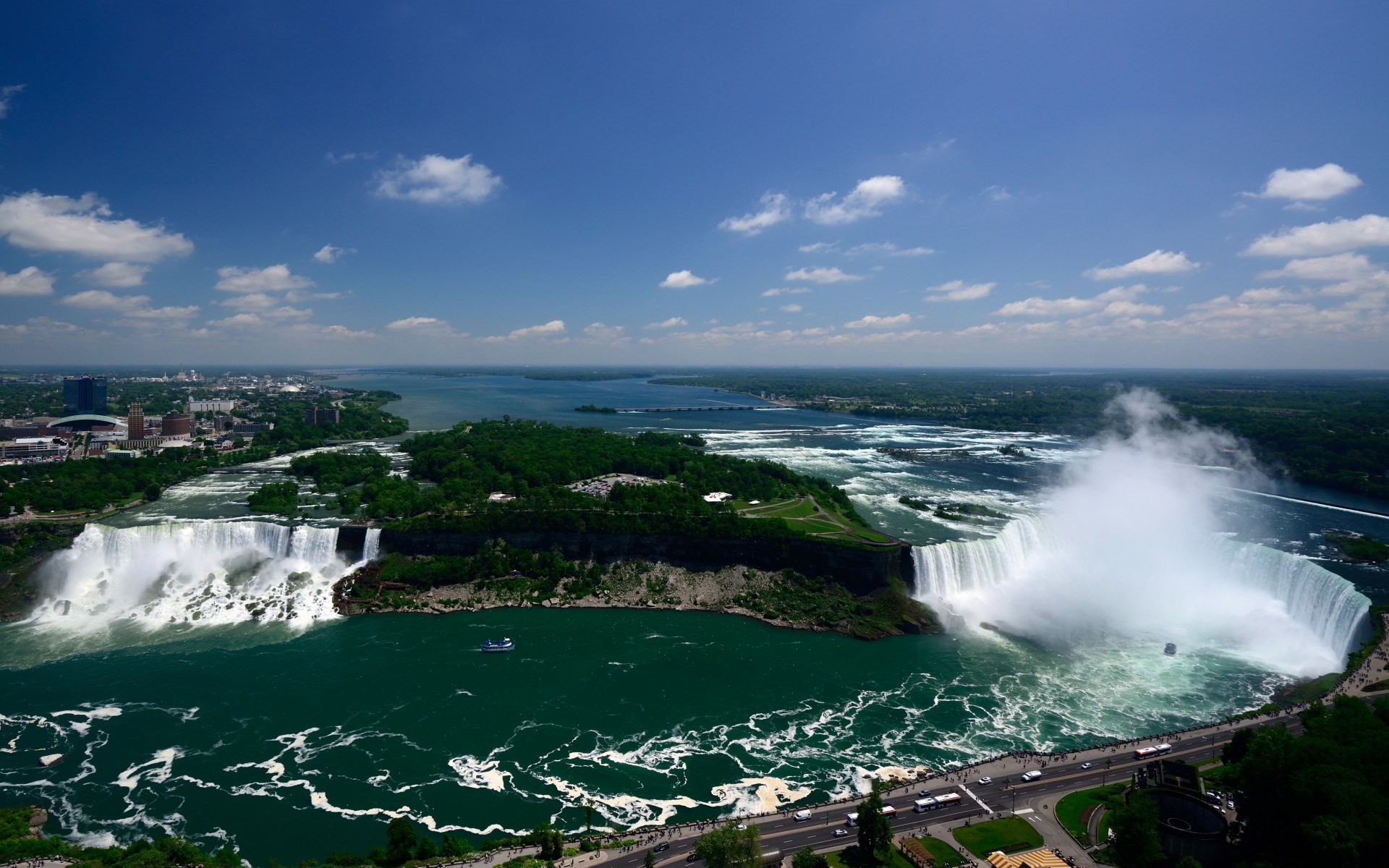 Niagara Falls with a boat and city skyline HD Wallpaper
