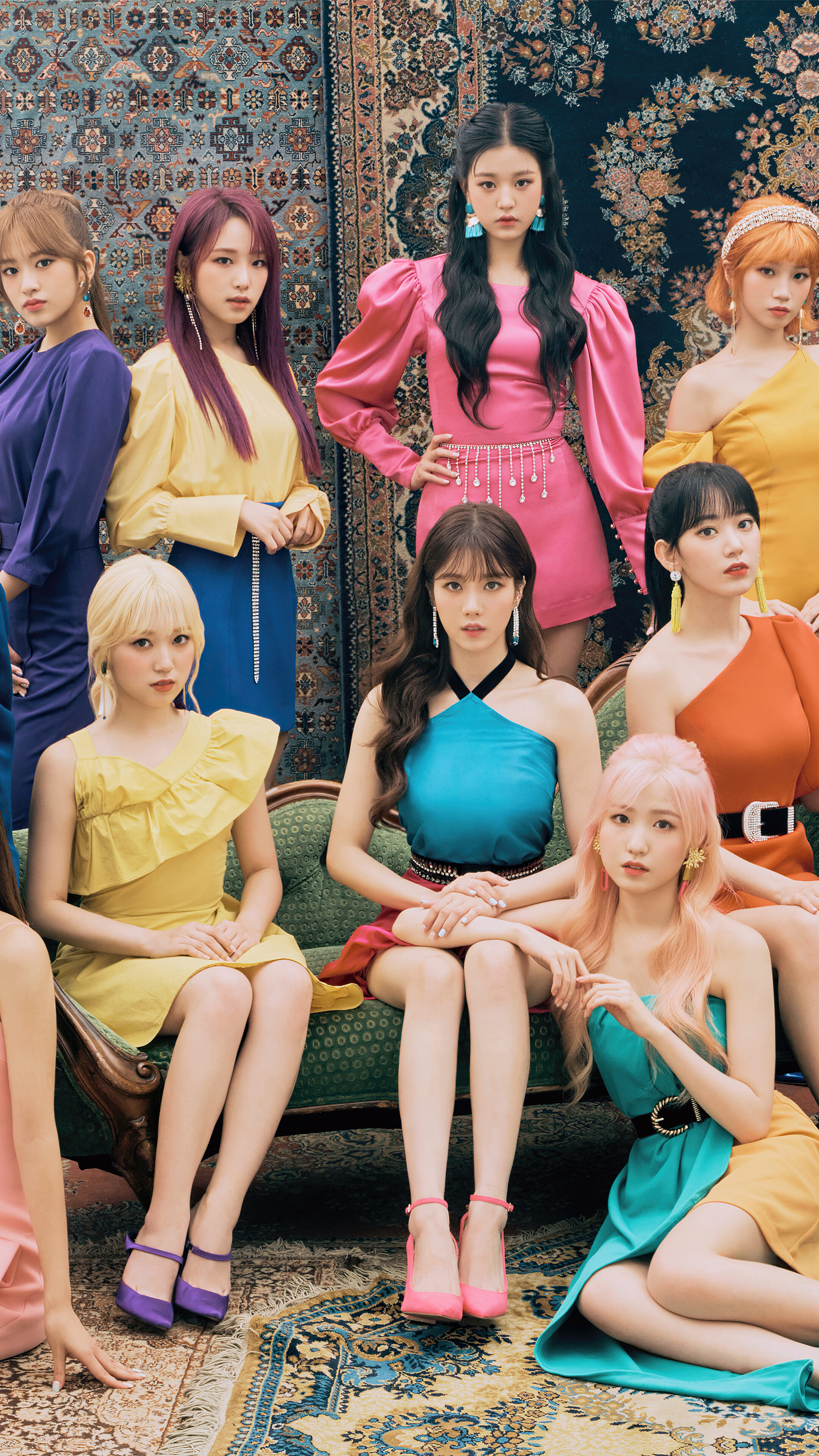 IZ*ONE members in colorful outfits HD Phone Wallpaper