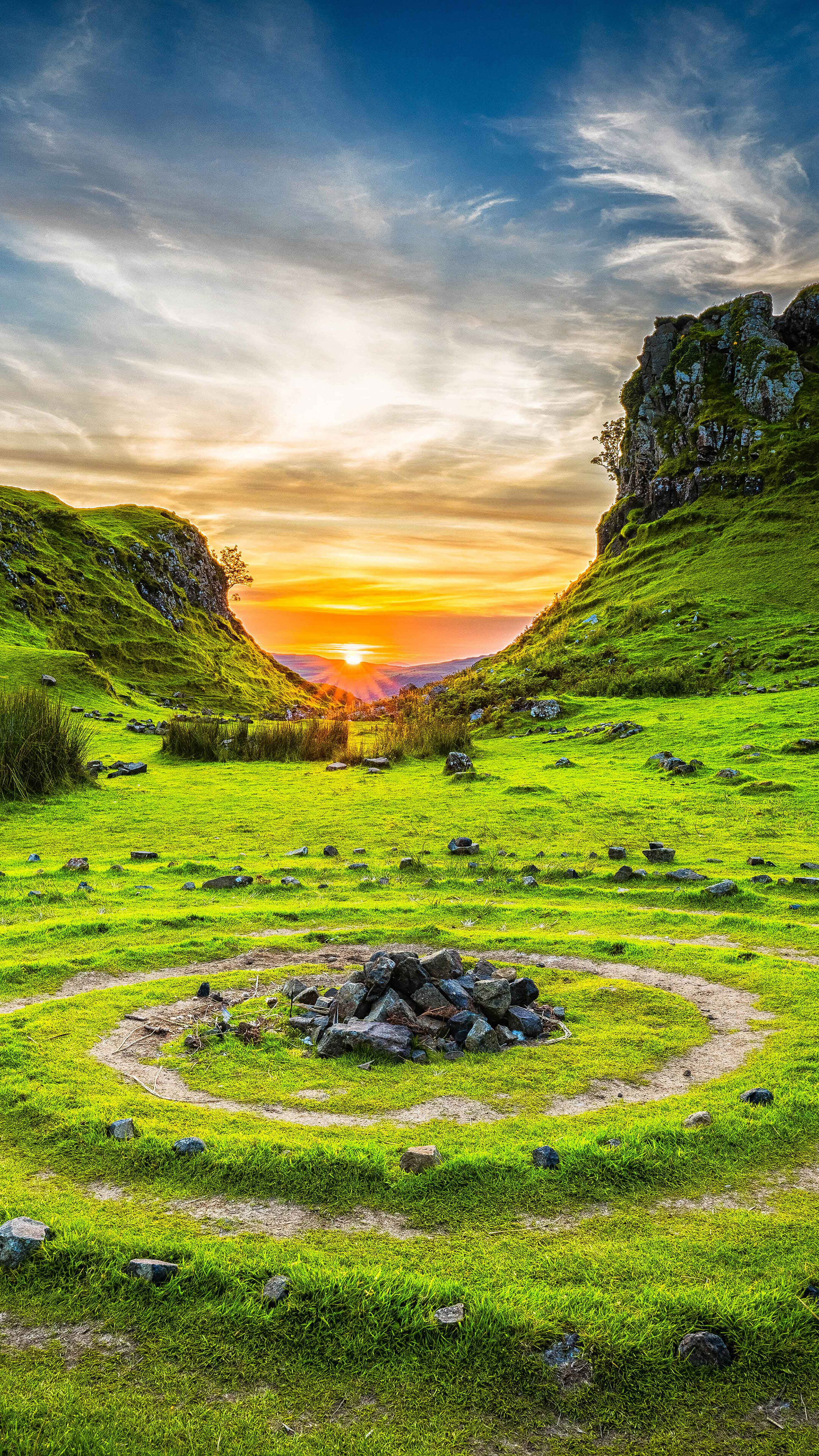 Sunrise over a grassy valley with a stone circle on Skye, United Kingdom HD Phone Wallpaper