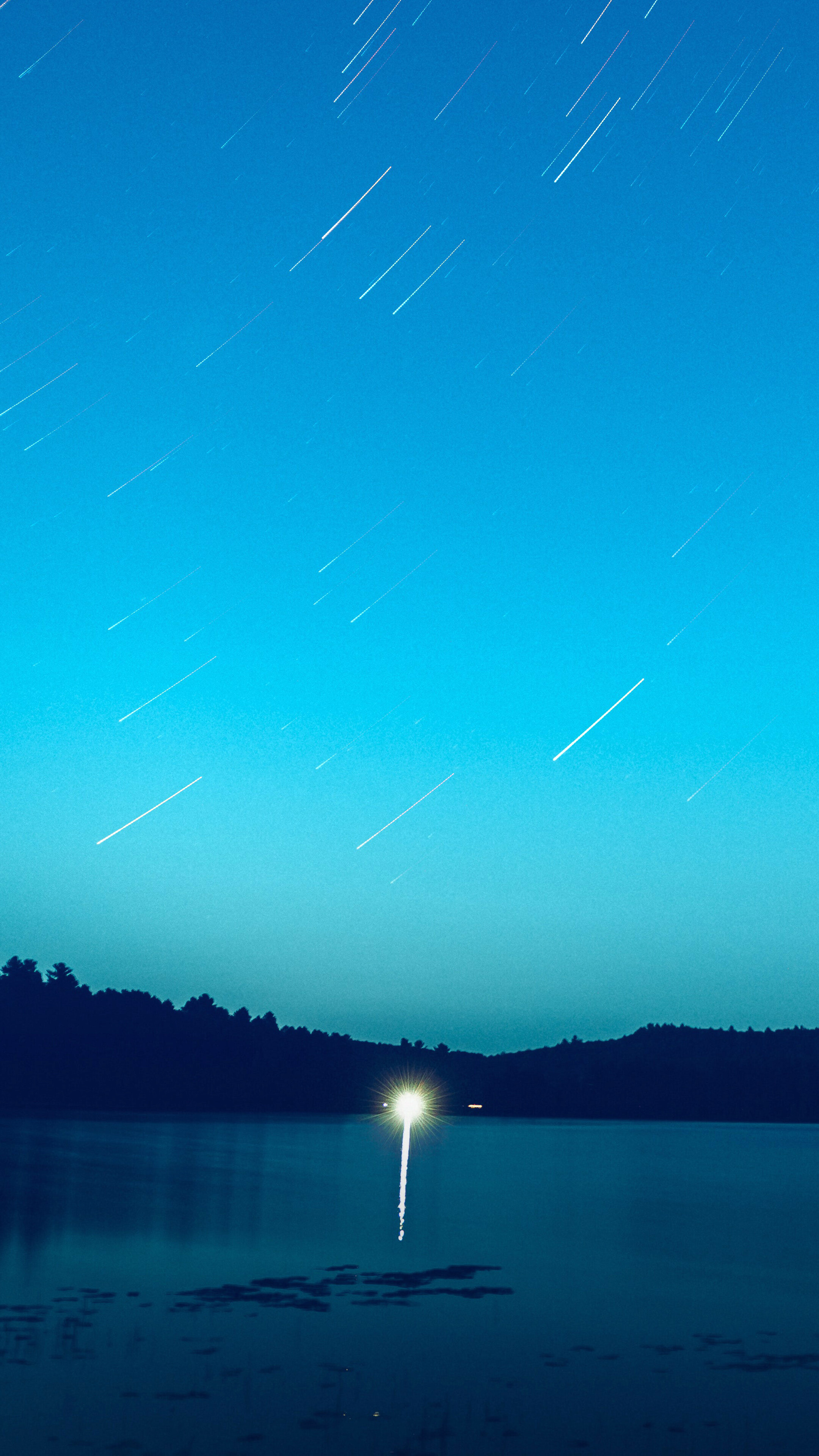Star trails over a lake at night HD Phone Wallpaper