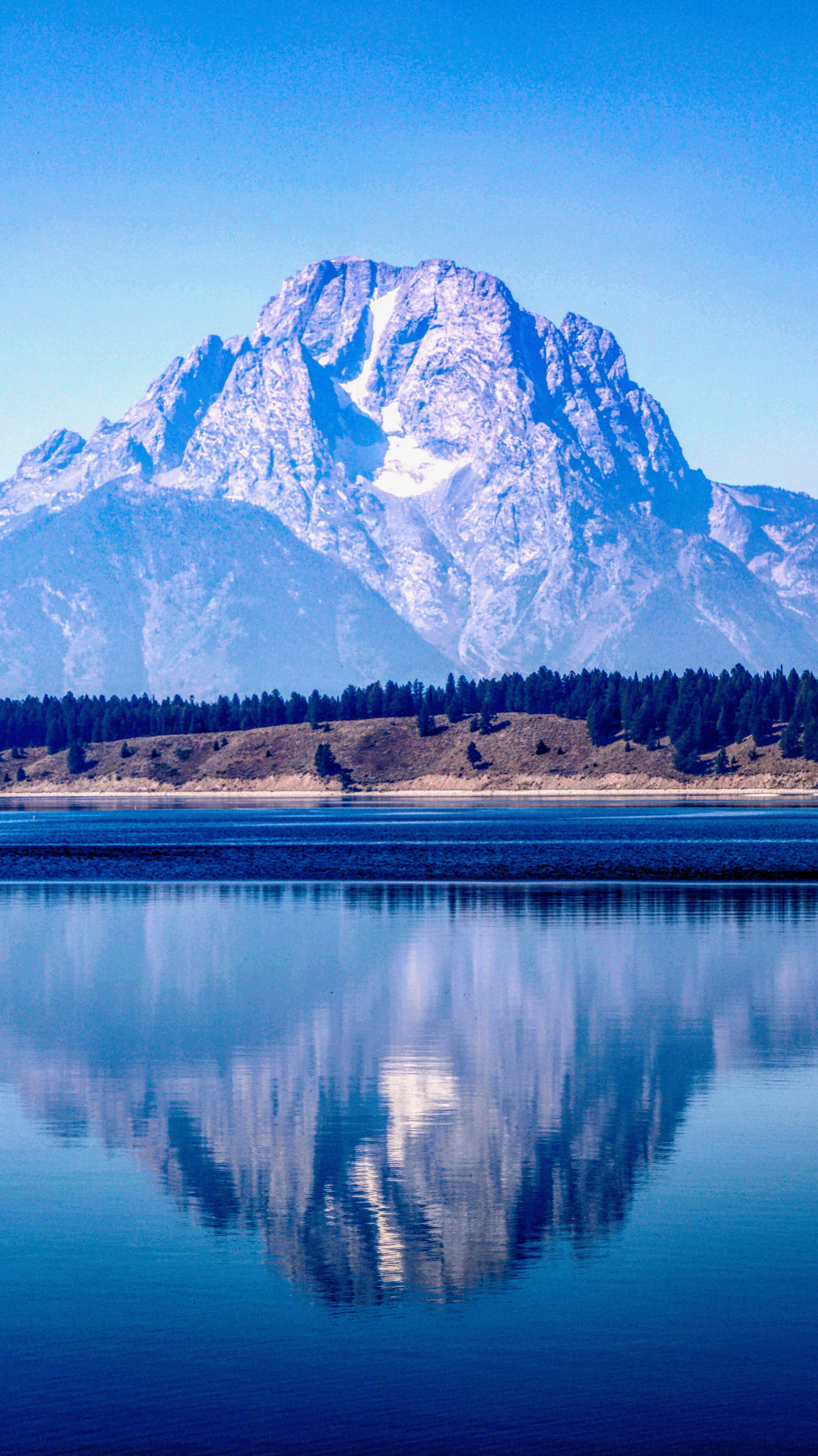 Snow-capped mountain reflected in a calm lake HD Phone Wallpaper