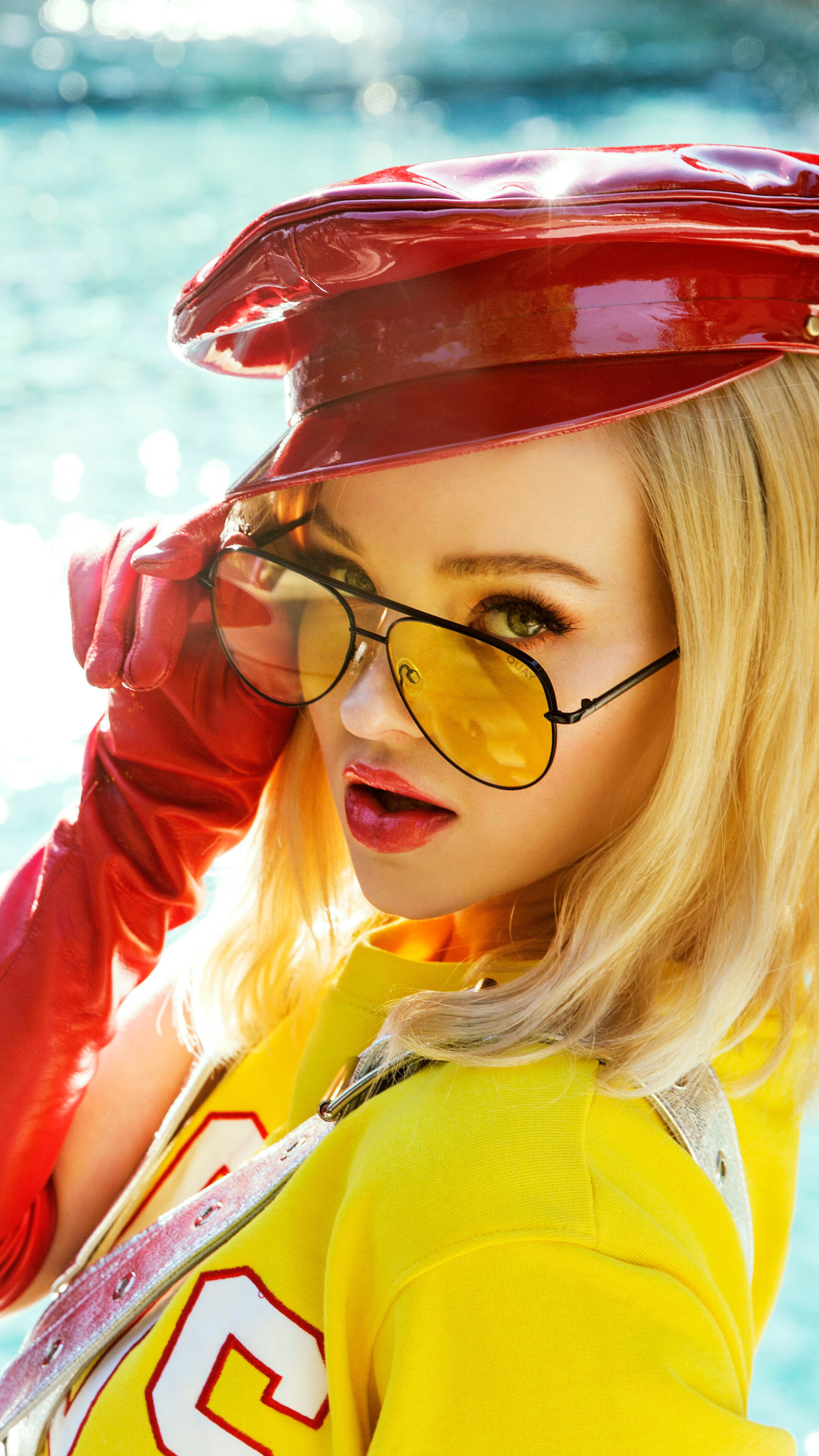 Dove Cameron wearing sunglasses and a red hat HD Phone Wallpaper