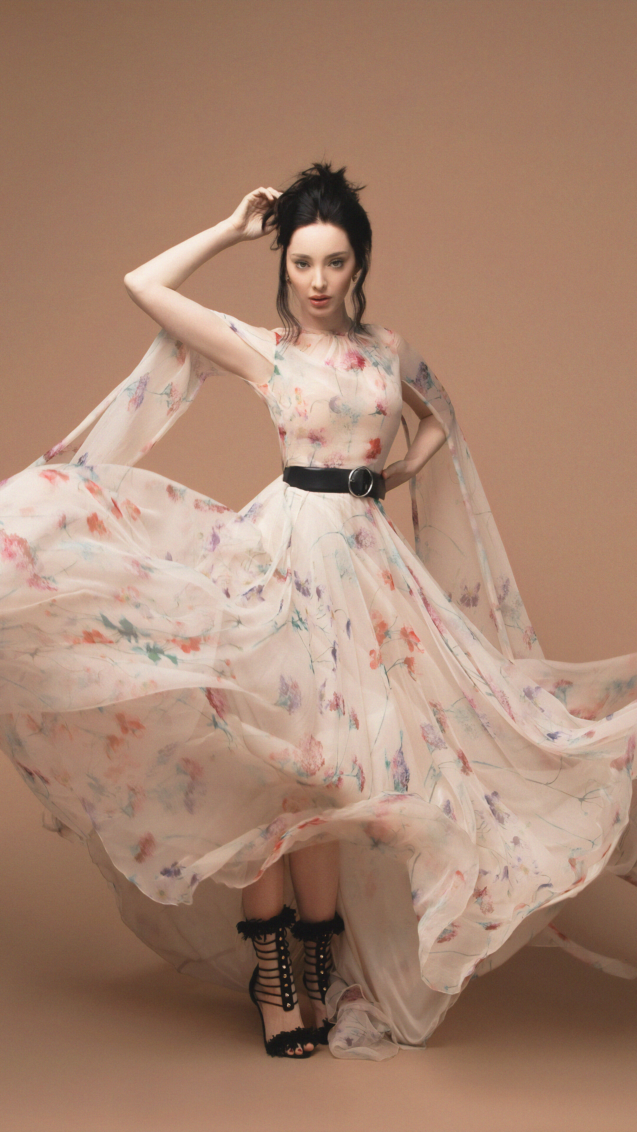 Emma Dumont in a floral dress HD Phone Wallpaper