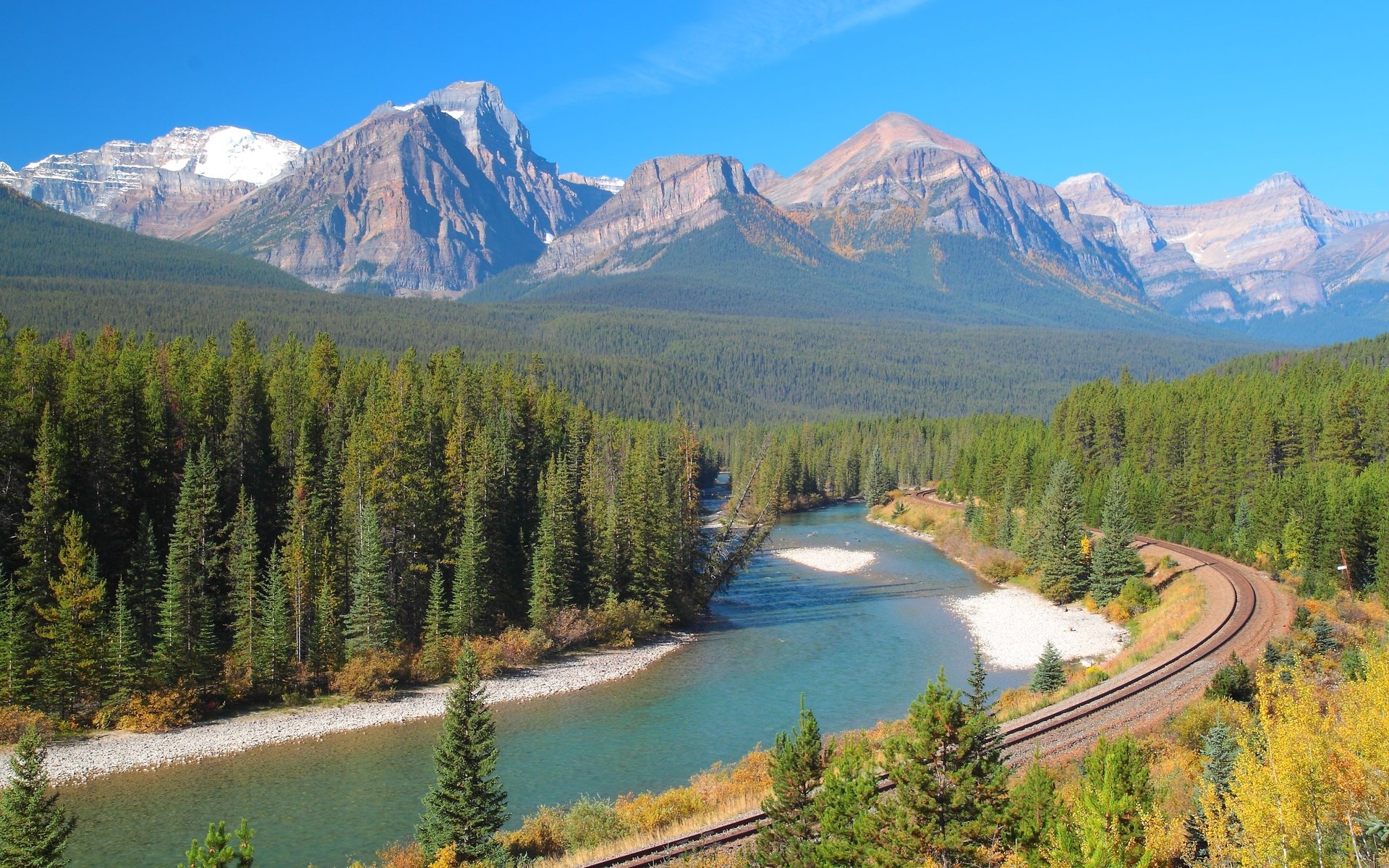 River and railway through a pine forest with mountains HD Wallpaper