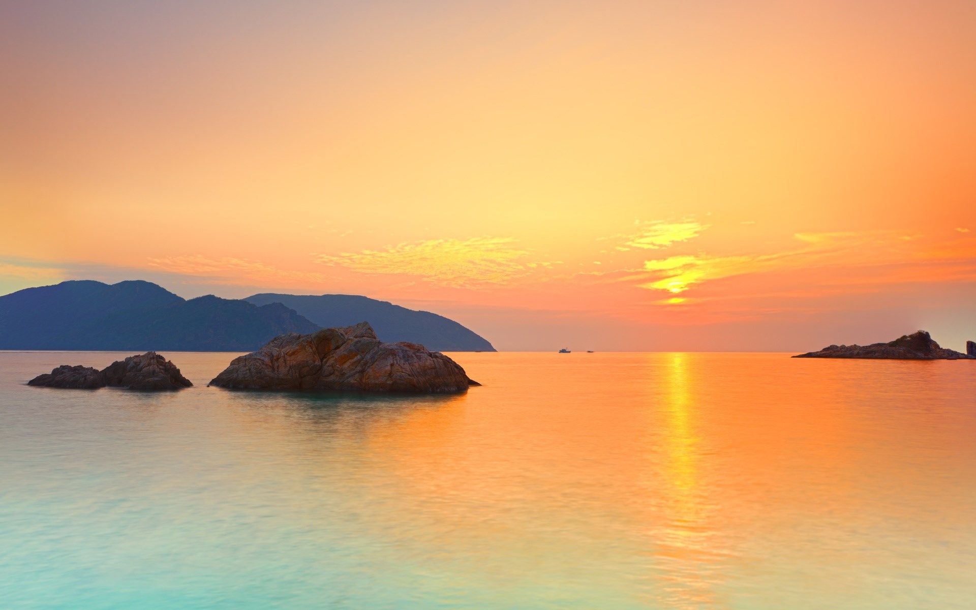 Sunset over the ocean with islands and rocks HD Wallpaper