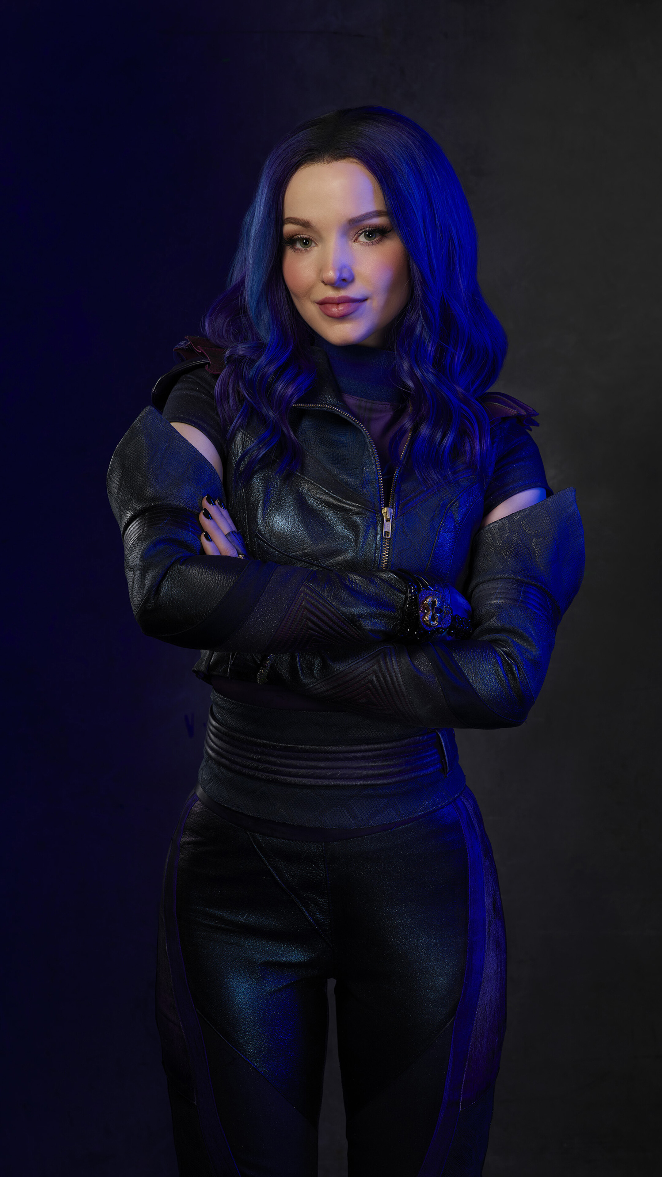 Dove Cameron in a black outfit with blue hair HD Phone Wallpaper