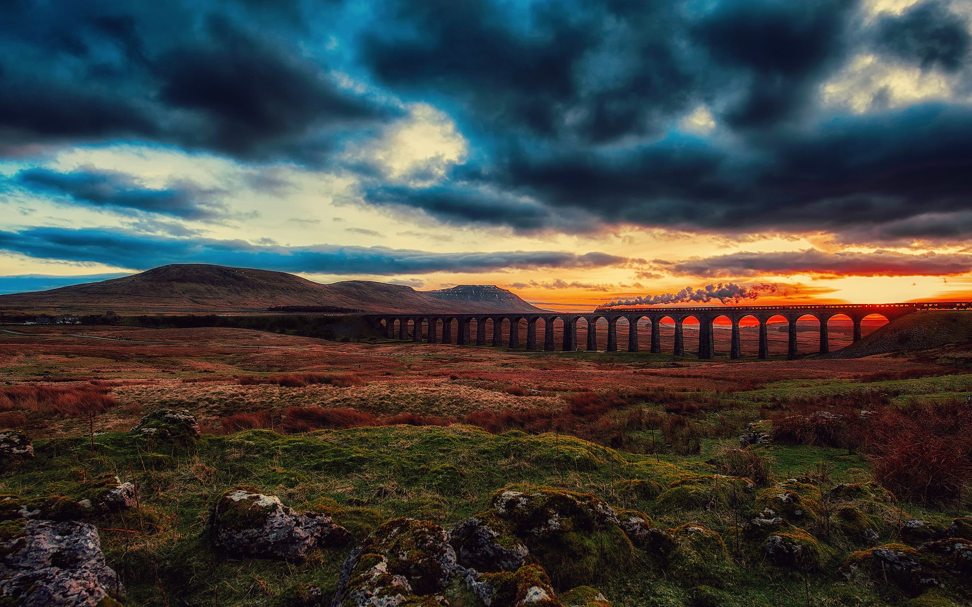 Steam train crossing a viaduct at sunset HD Wallpaper