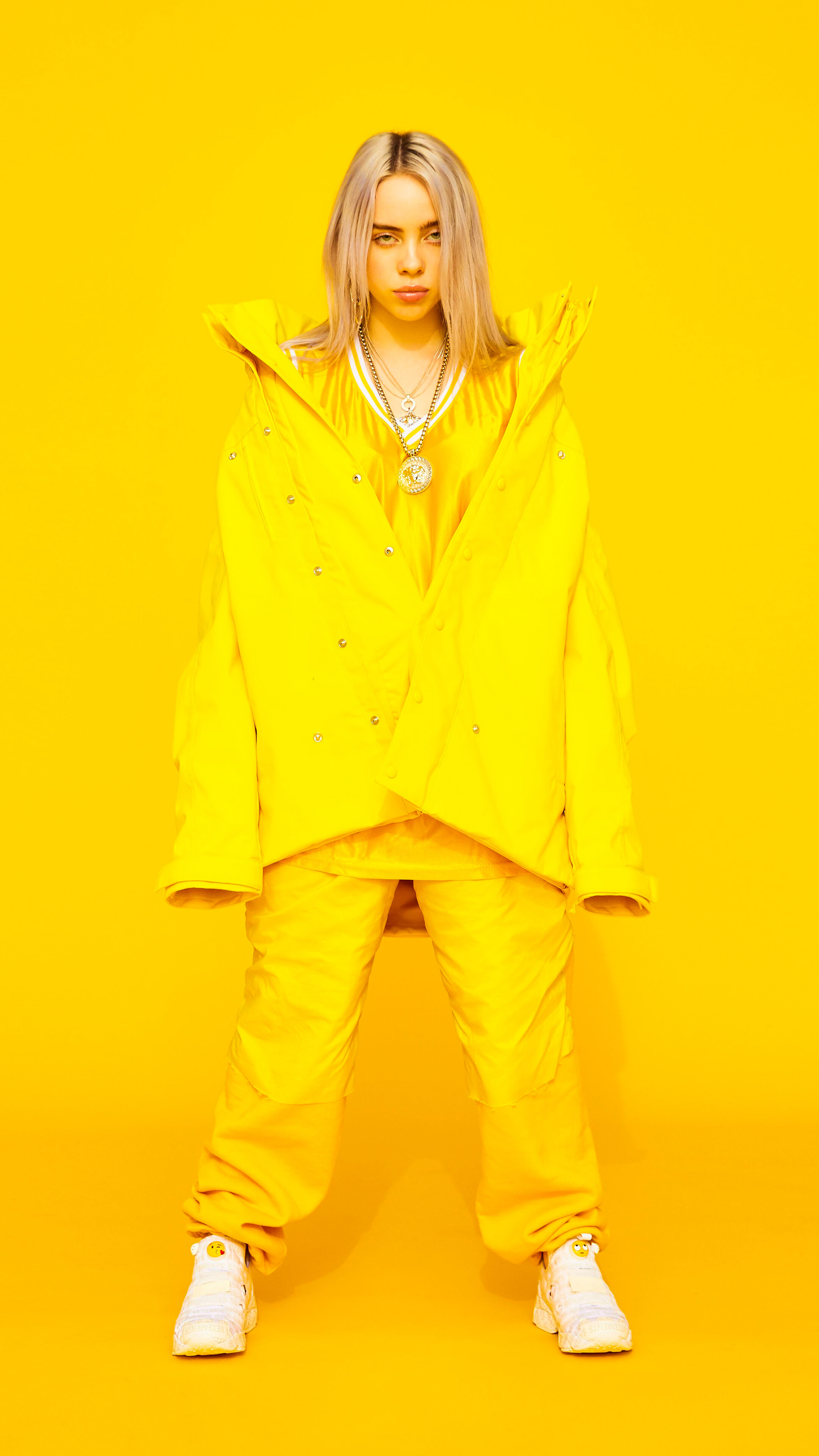 Billie Eilish in yellow outfit HD Phone Wallpaper