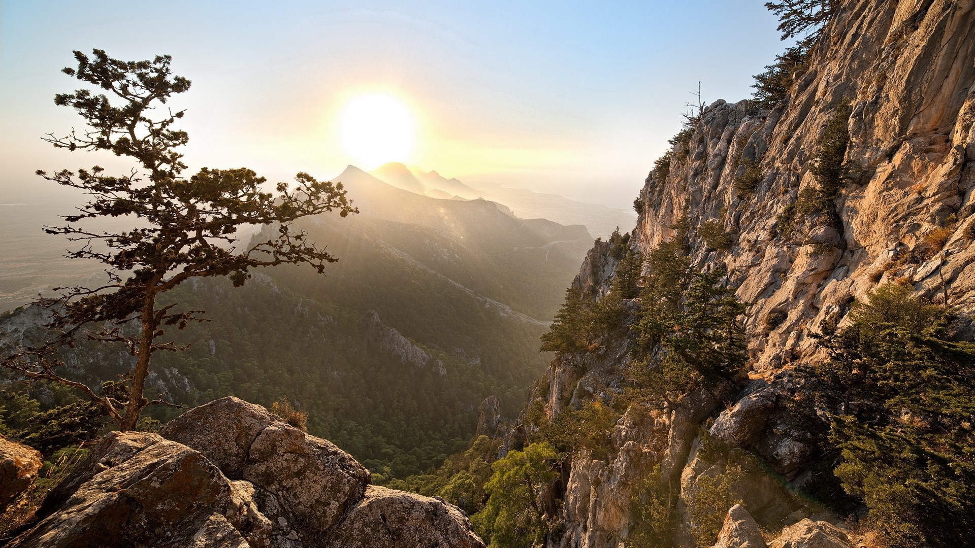 Sunrise over a mountain valley with rocky cliffs HD Wallpaper
