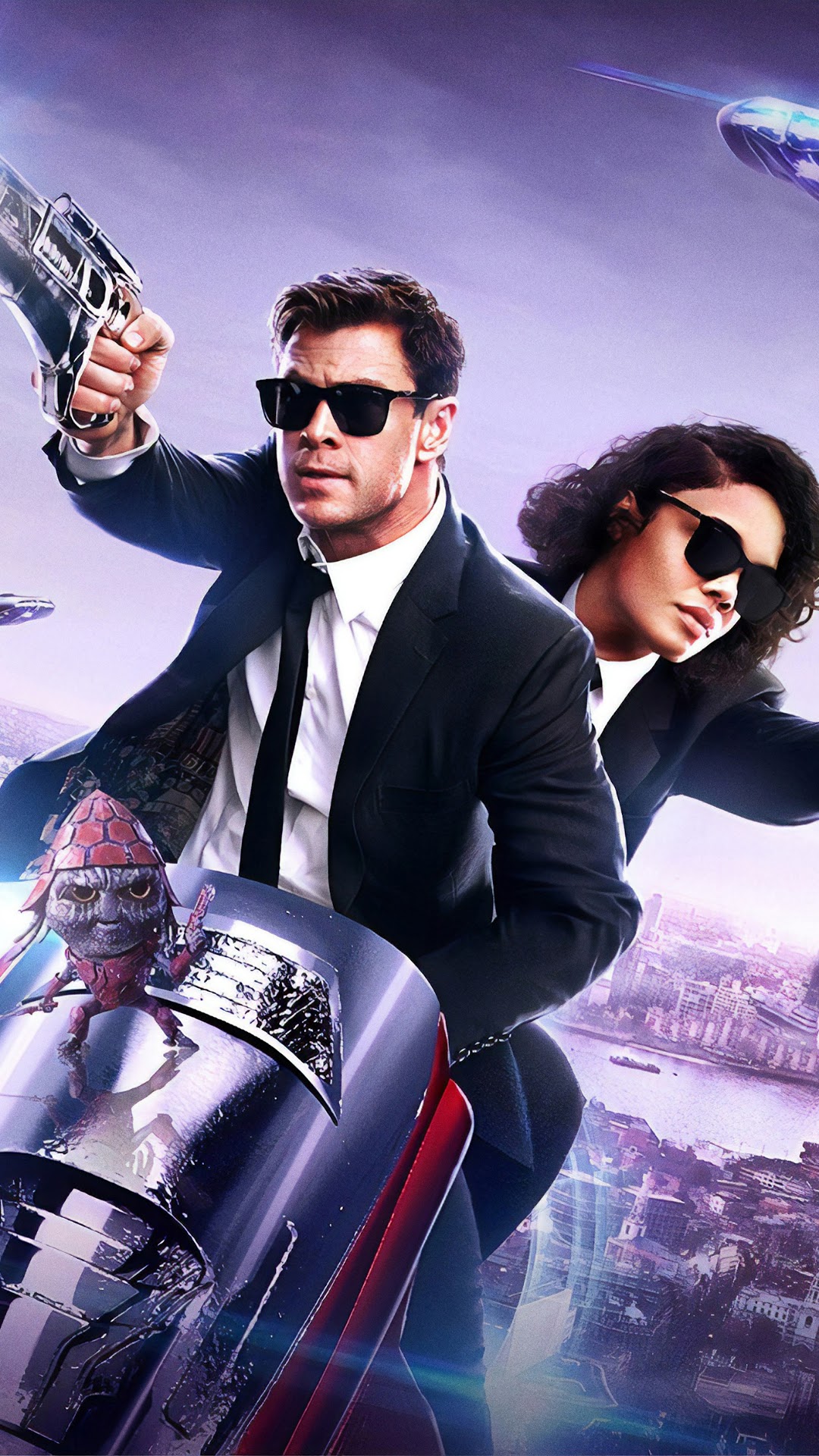 Men in Black International: Chris Hemsworth and Tessa Thompson HD Phone Wallpaper
