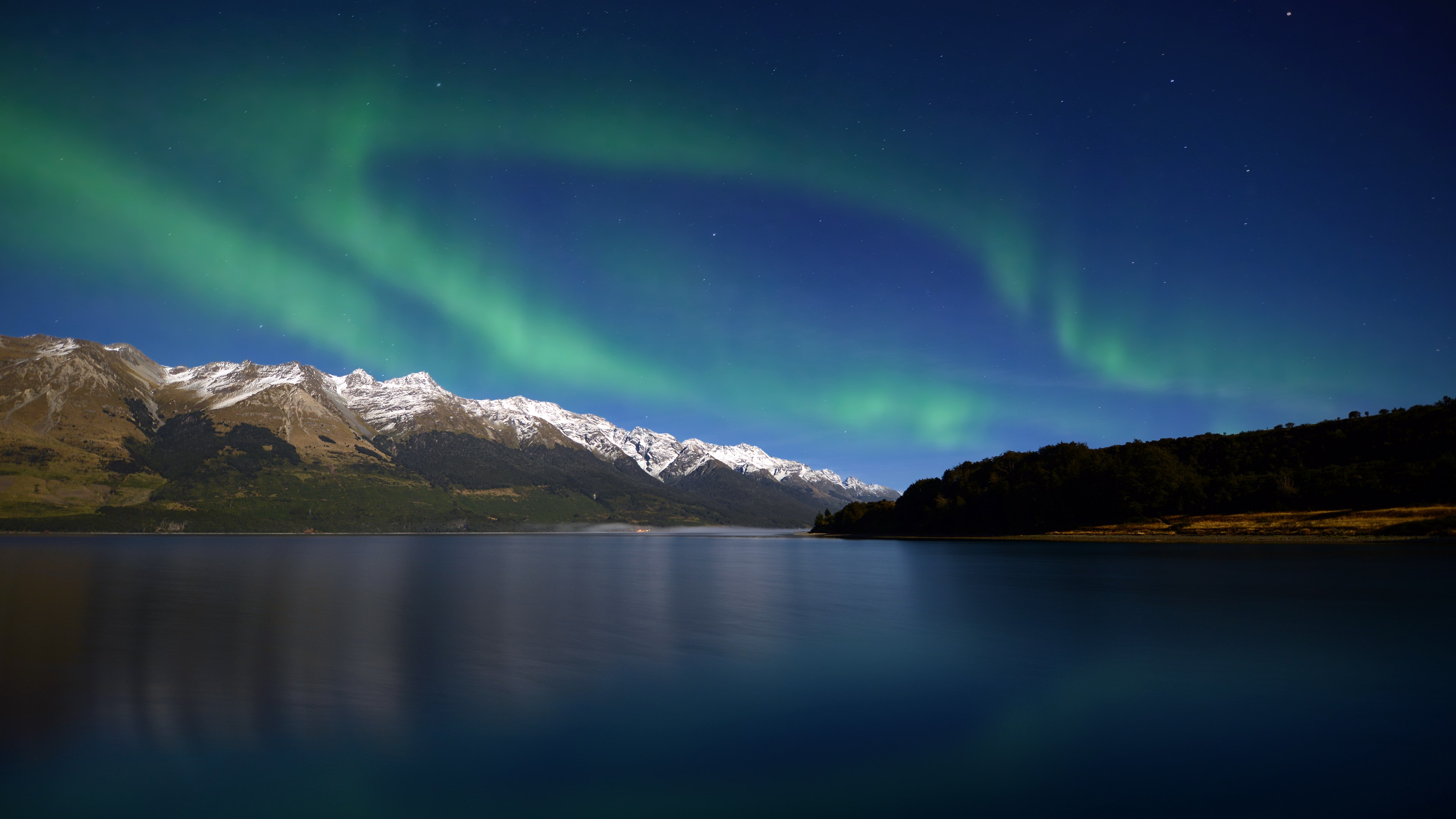 Aurora Borealis over snow-capped mountains and lake HD Wallpaper