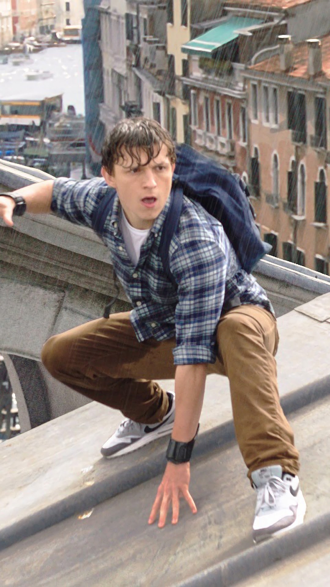 Peter Parker from Spider-Man: Far From Home on a rooftop HD Phone Wallpaper