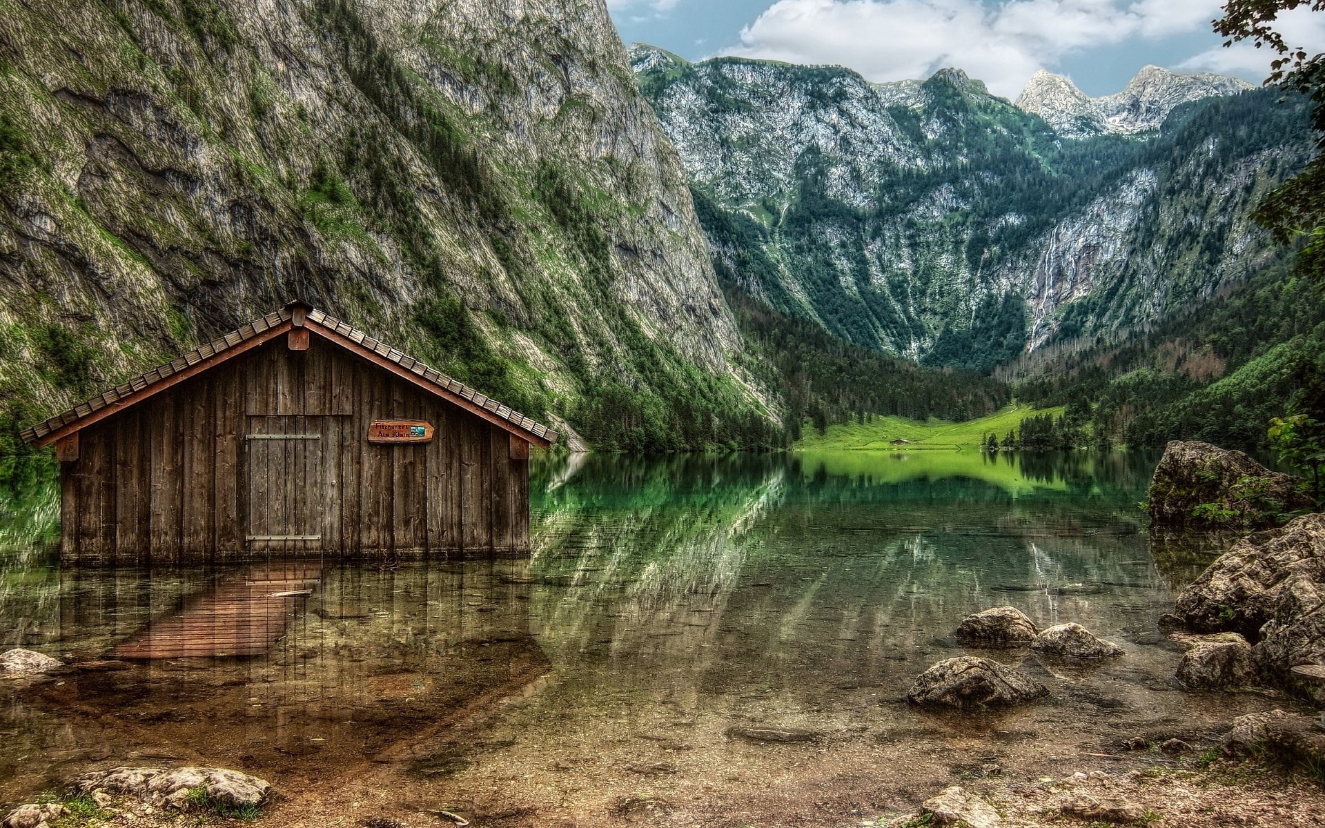 Wooden boathouse on a clear lake with mountains HD Wallpaper